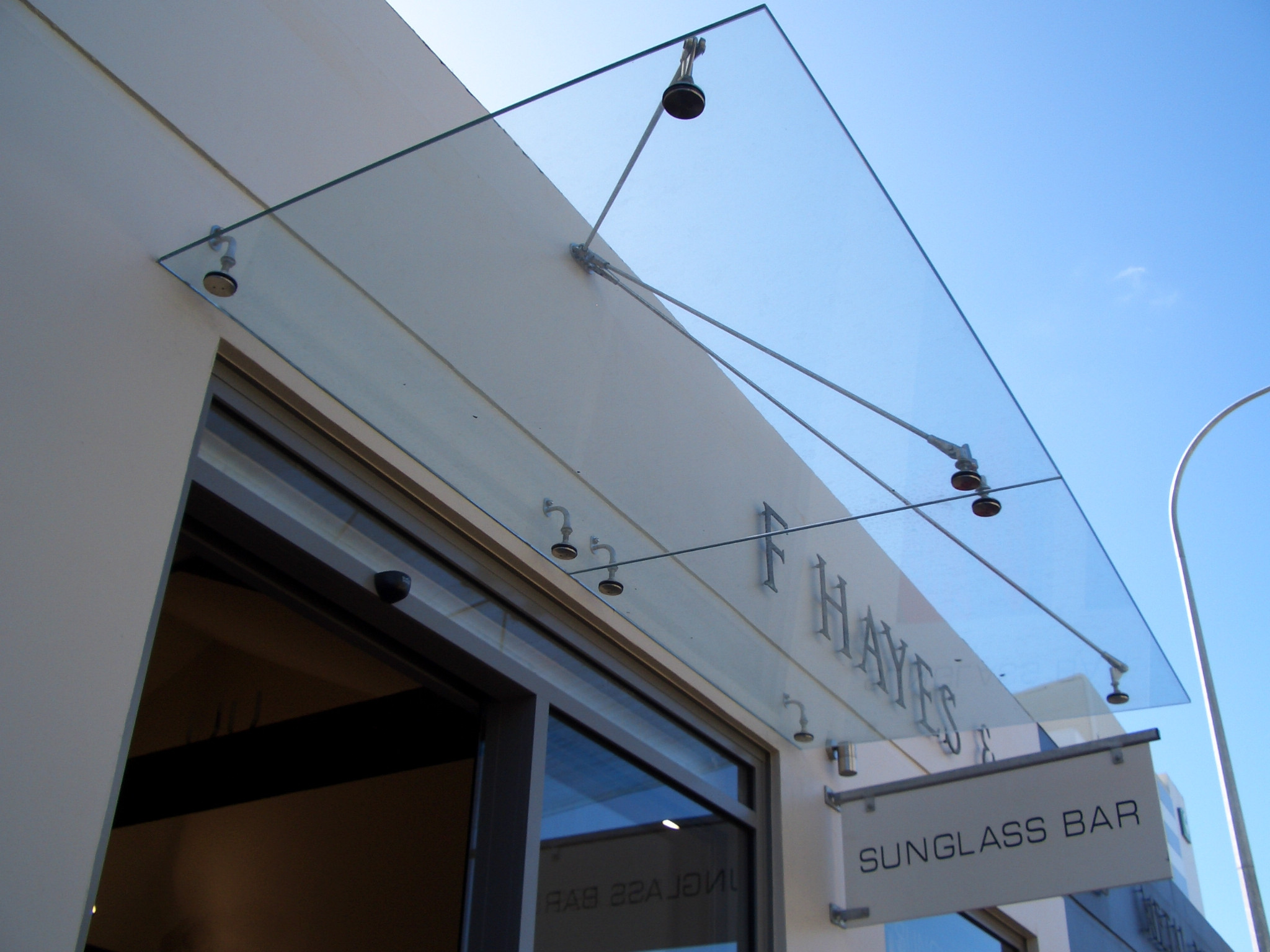 White  building with a sleek glass canopy