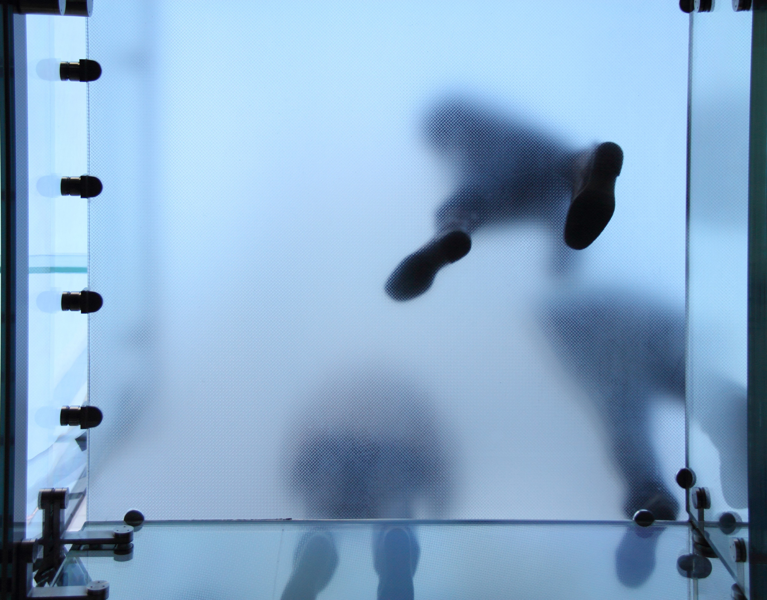 Frosted floor glass with peoples footprints