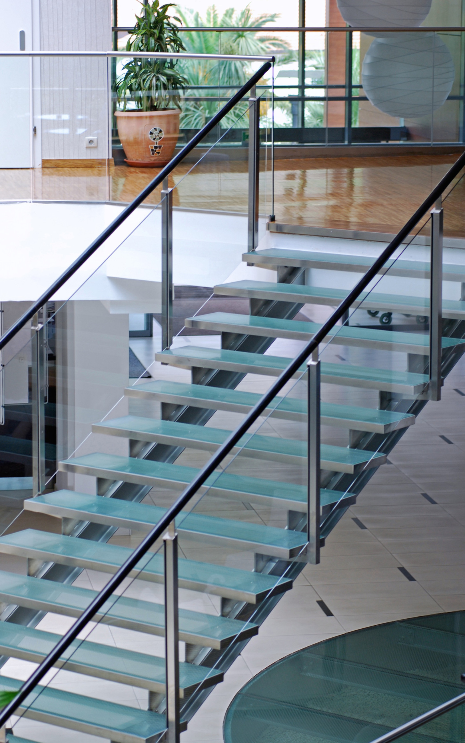 Patterned glass stairs with timber floors