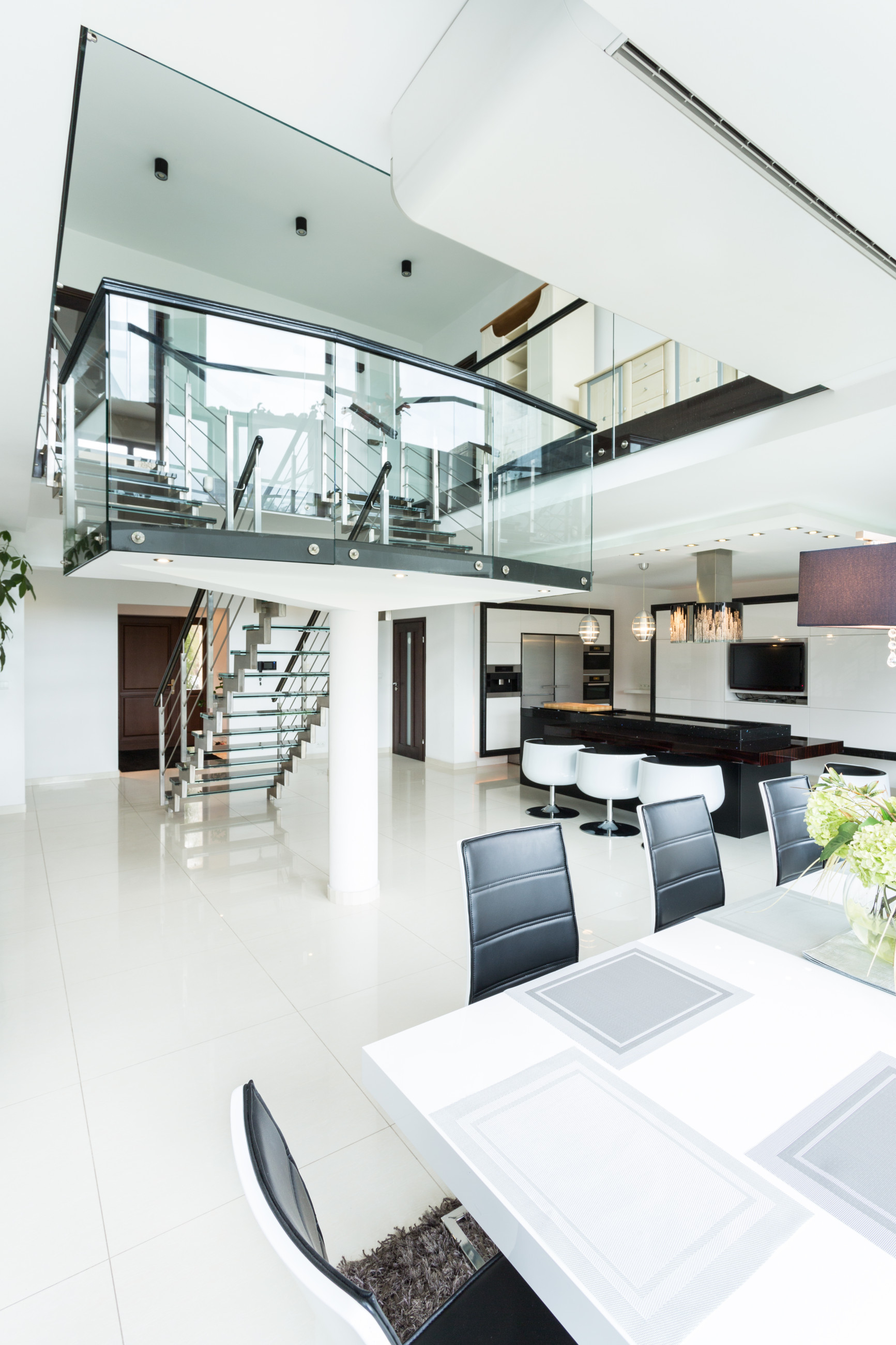 Patterned glass stairs in white office space