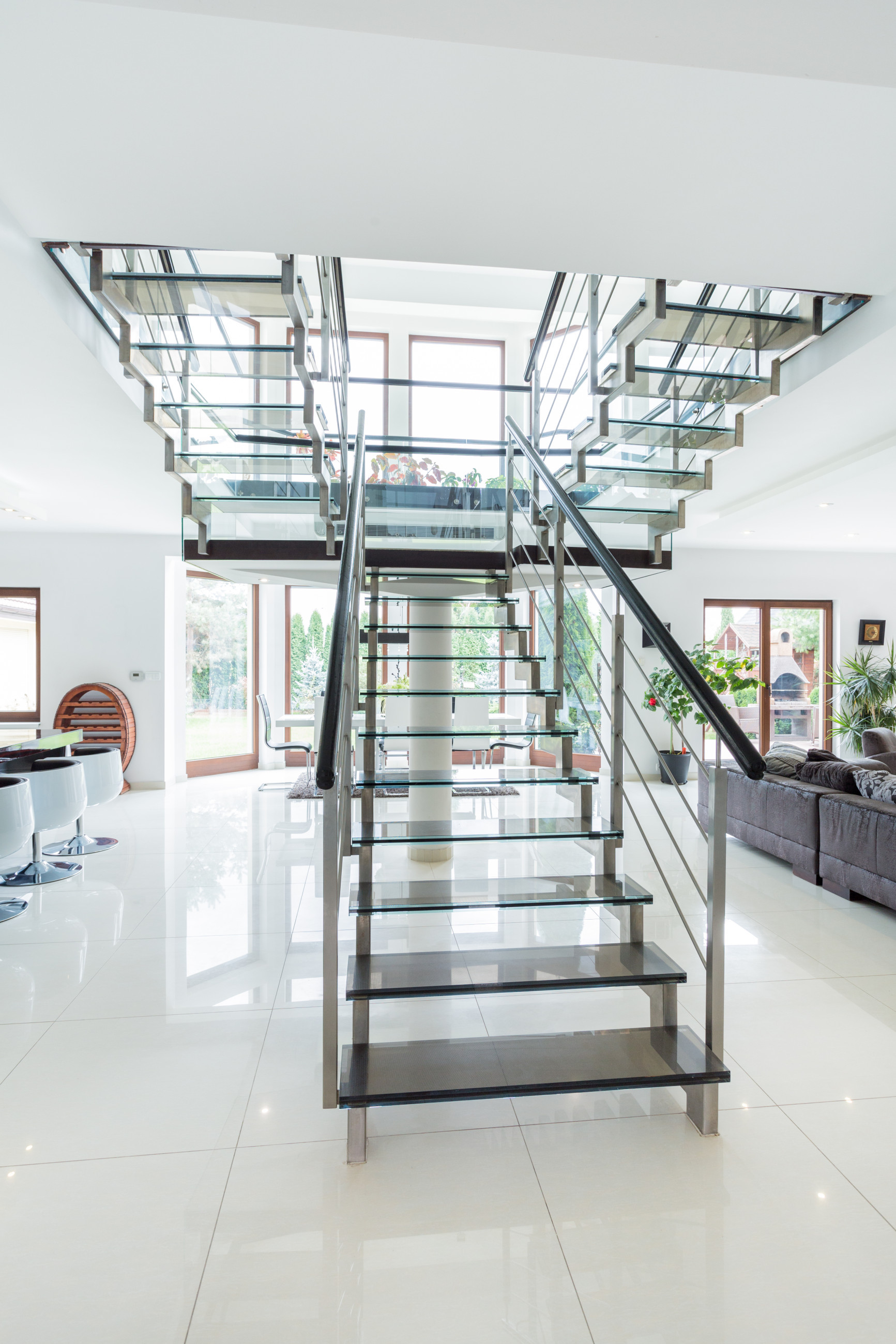 White office space with a staircase featuring patterned glass steps