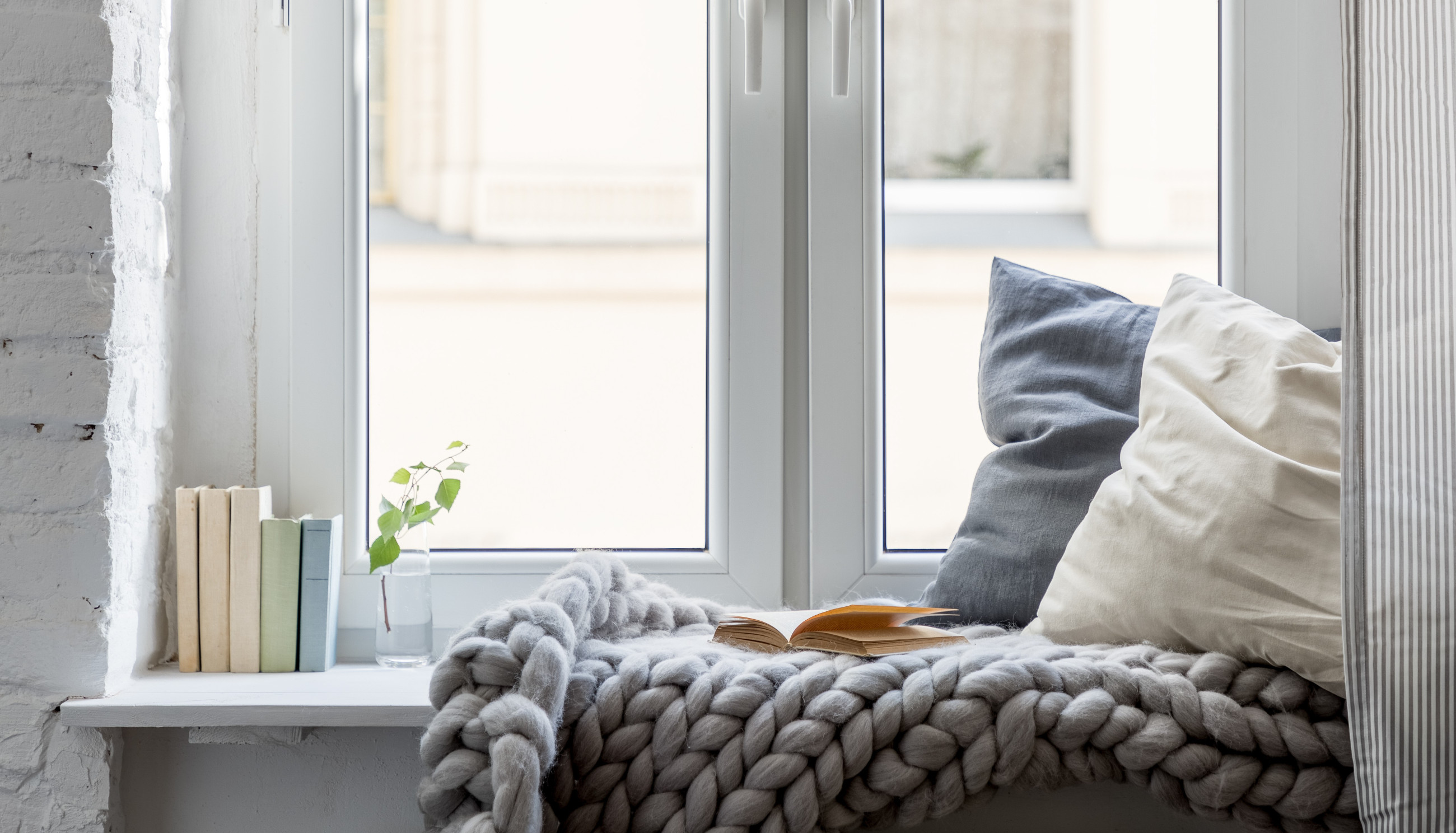 Double glazed windows casting a warm, inviting glow with sunlight streaming through