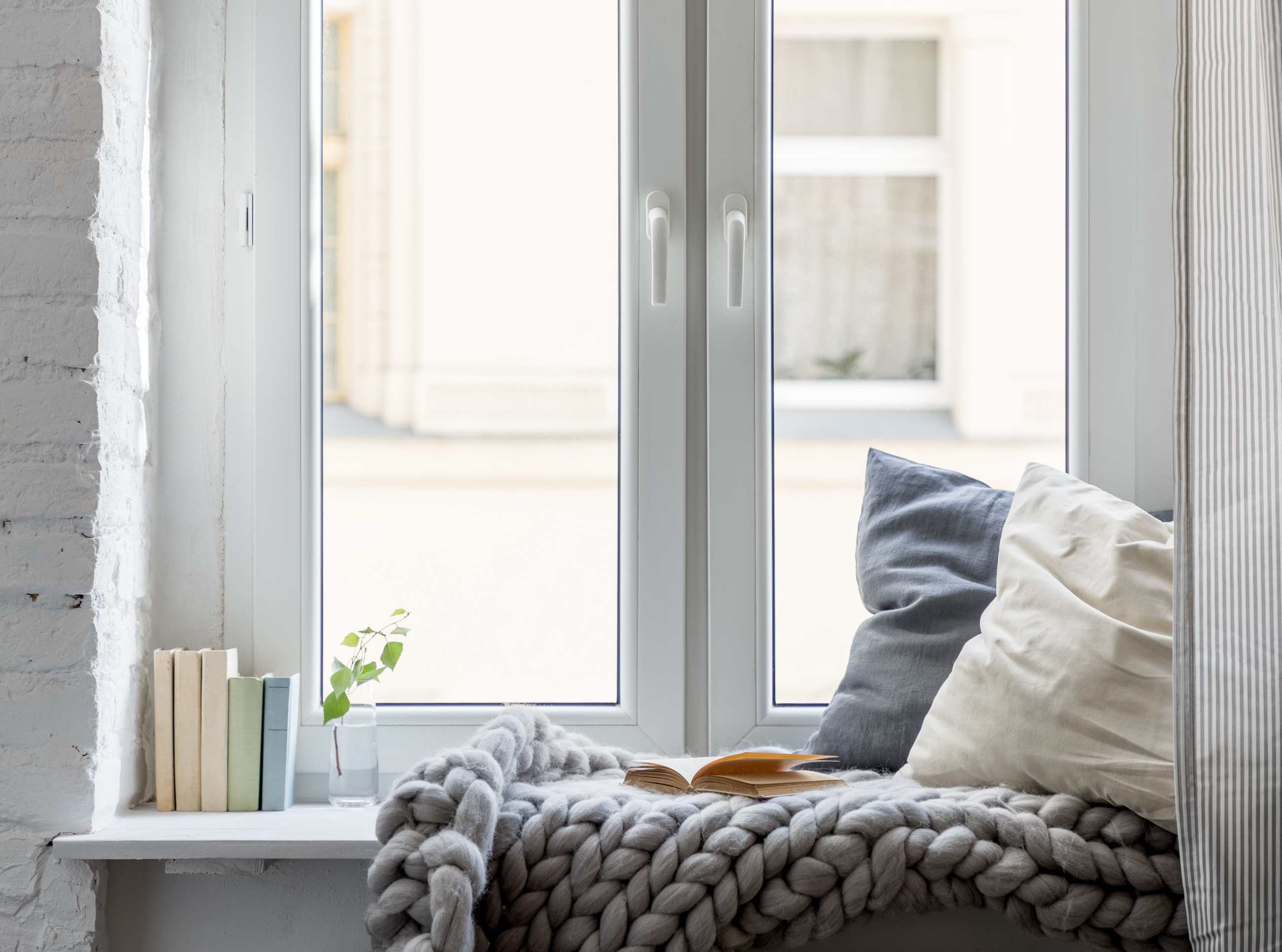 Double glazed windows casting a warm, inviting glow with sunlight streaming through