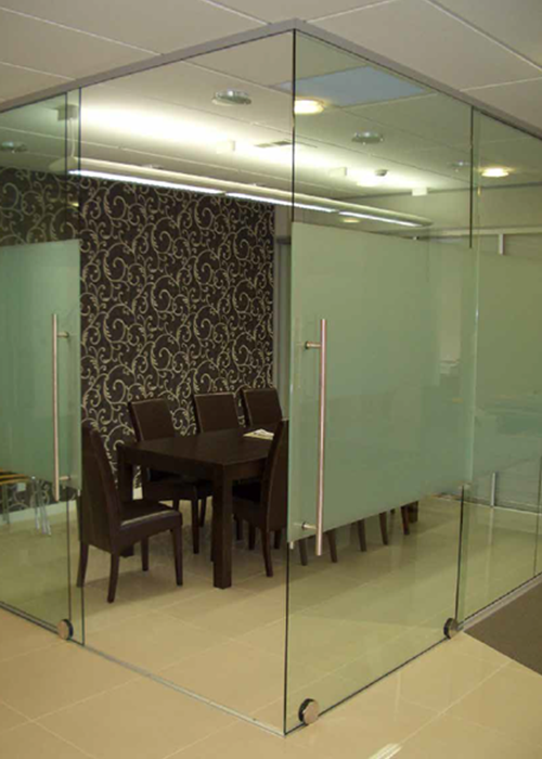 Glass tinted glass panel partitions in office building