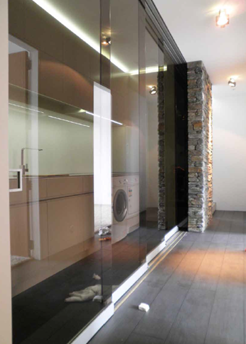 Tinted glass panel partitions creating private spaces in an office building
