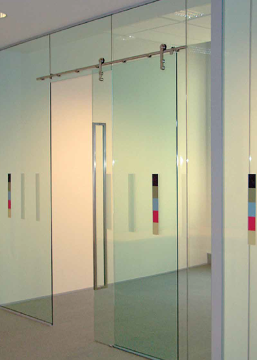 Sleek glass entrance doors leading into a modern commercial space
