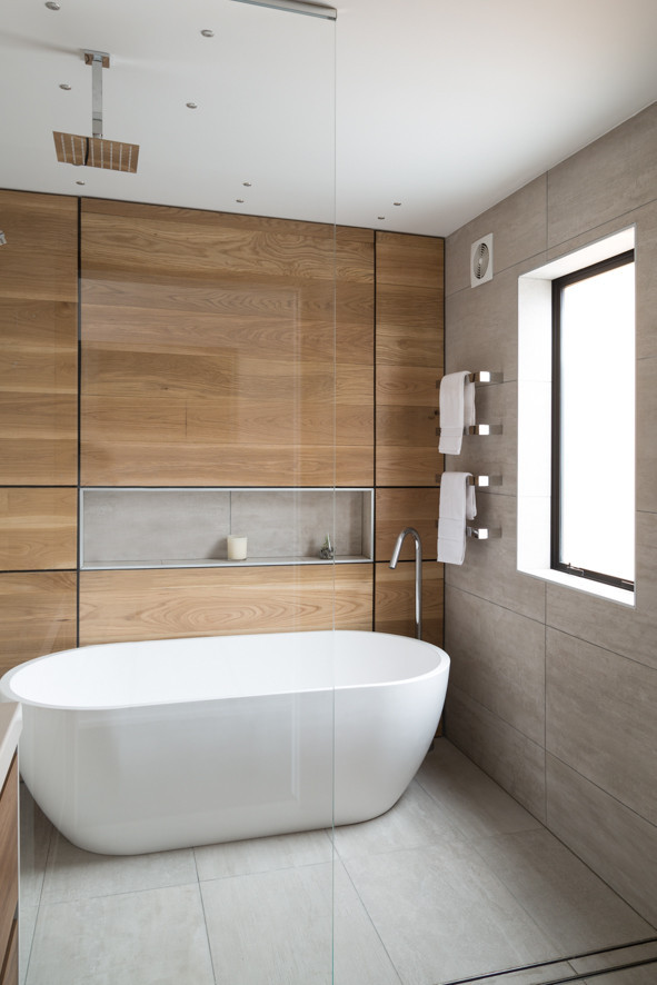 Glass shower screen with a bathtub and a timber backdrop