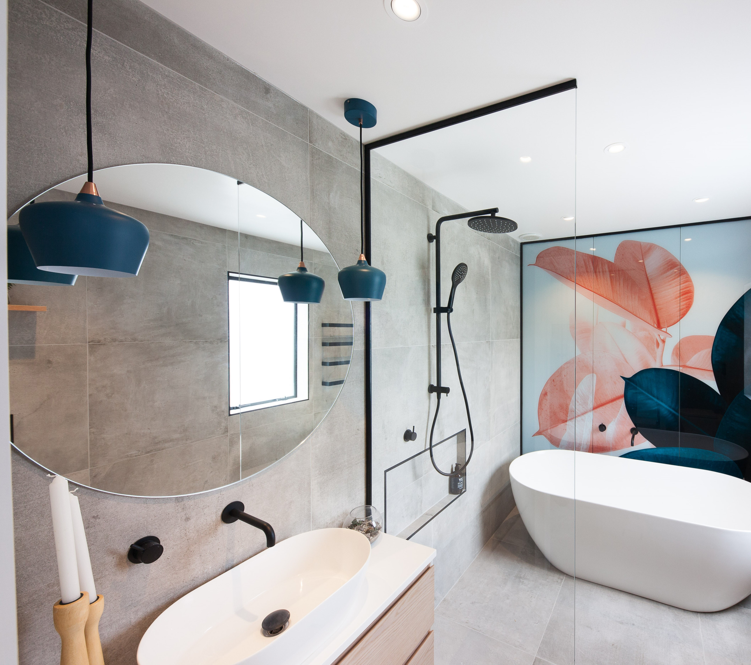 Glass shower screen with a bathtub and a digitally printed backdrop for aesthetic appeal