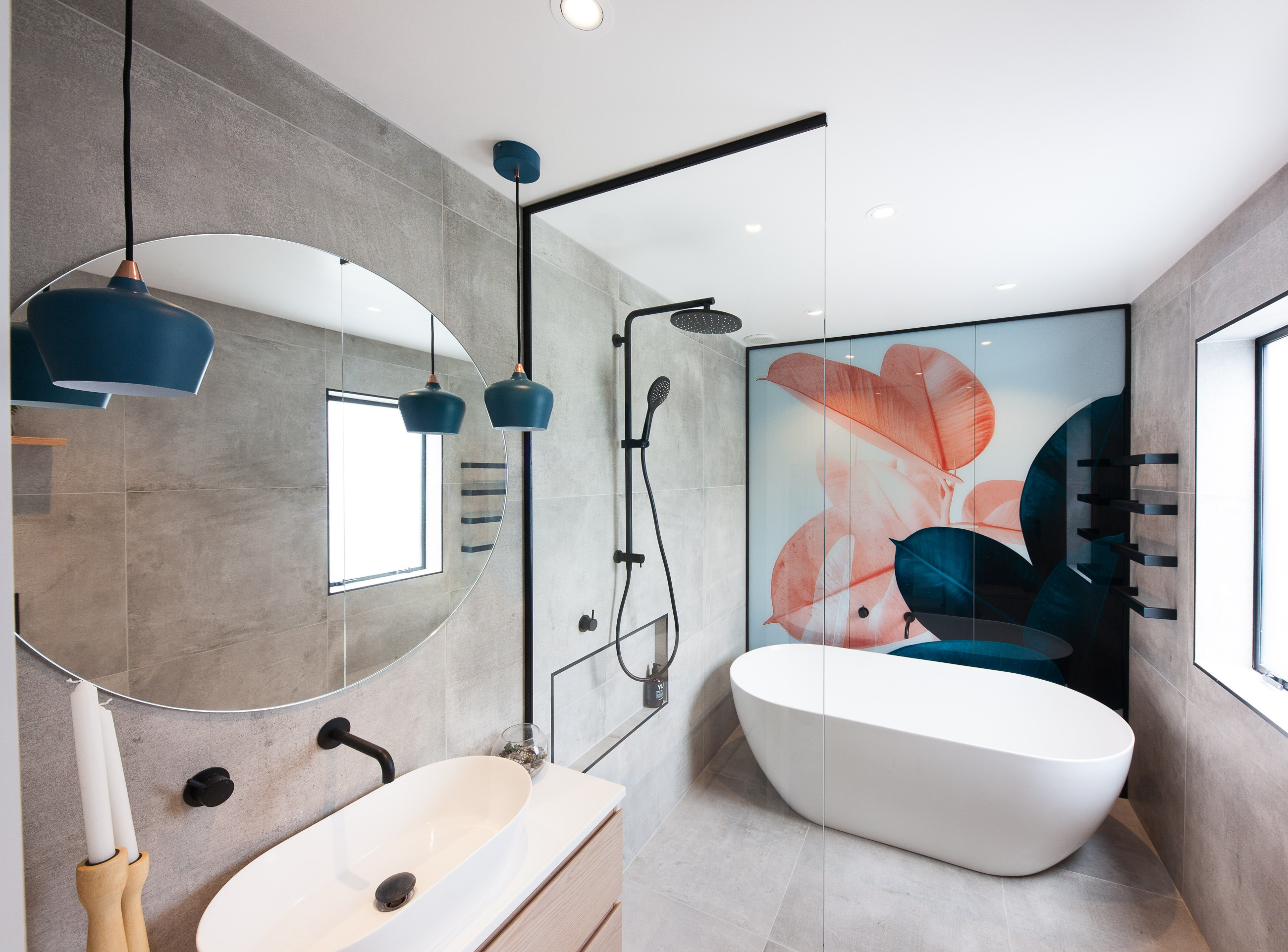 Glass shower screen with a bathtub and a digitally printed backdrop for aesthetic appeal