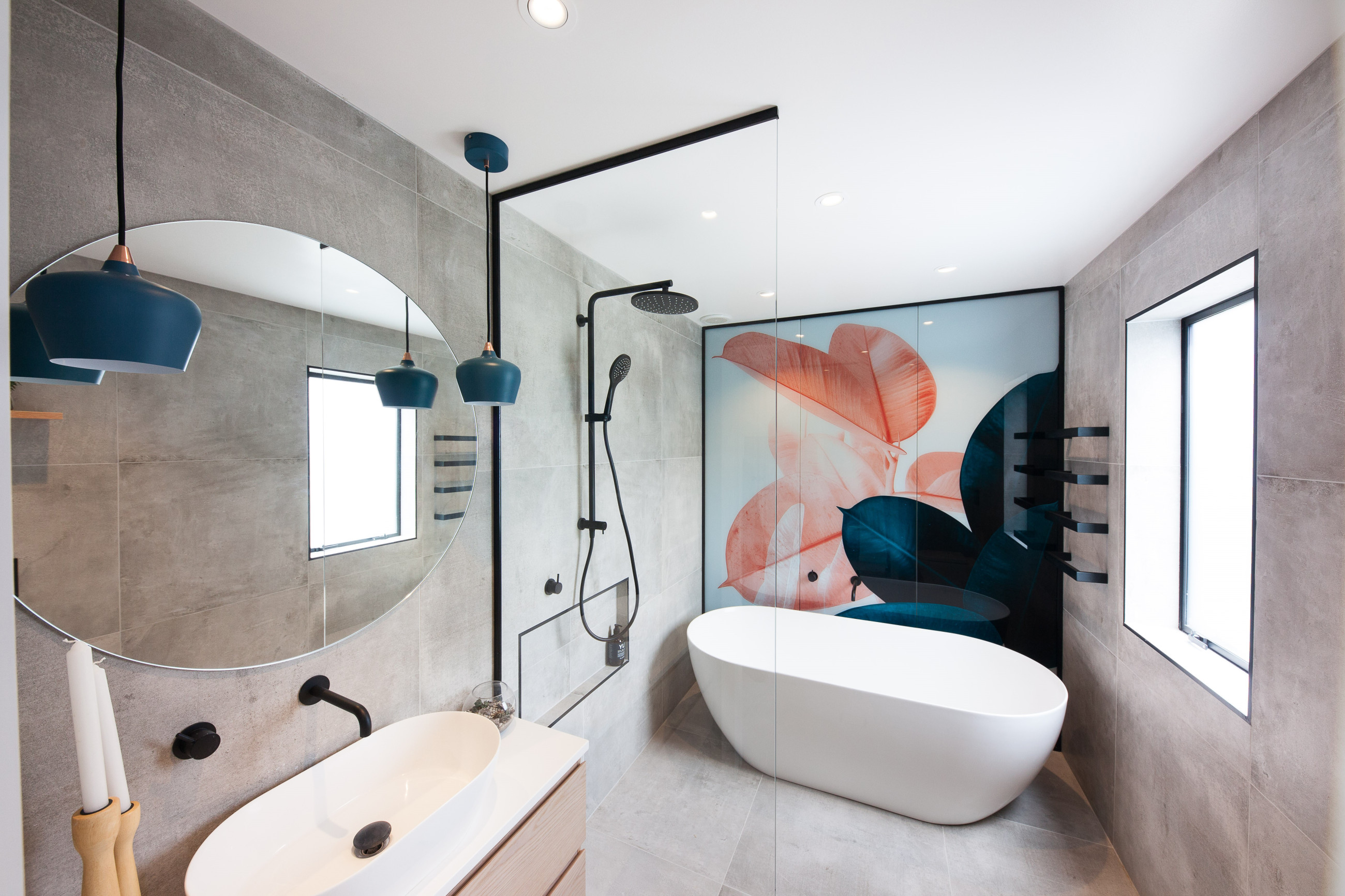 Glass shower screen with a bathtub and a digitally printed backdrop for aesthetic appeal