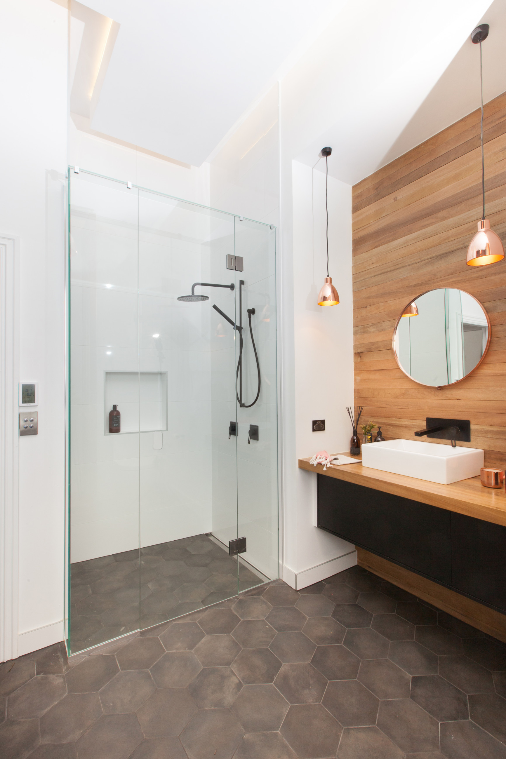 corner shower in bathroom with timber paneling tiles