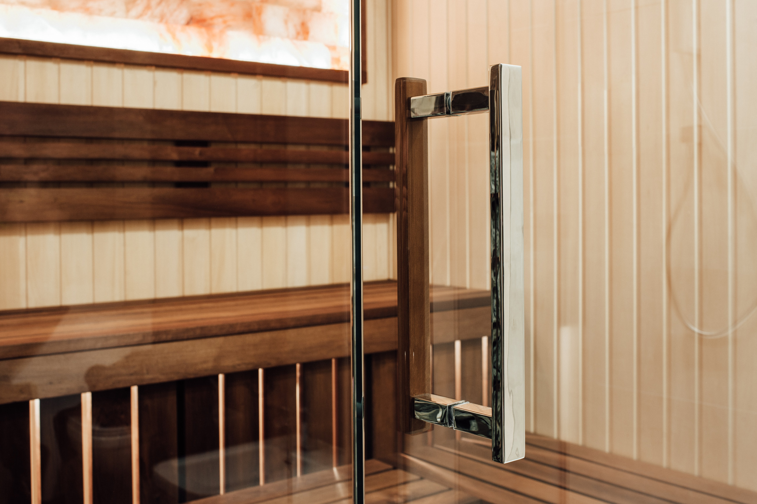 Glass door handle entering sauna