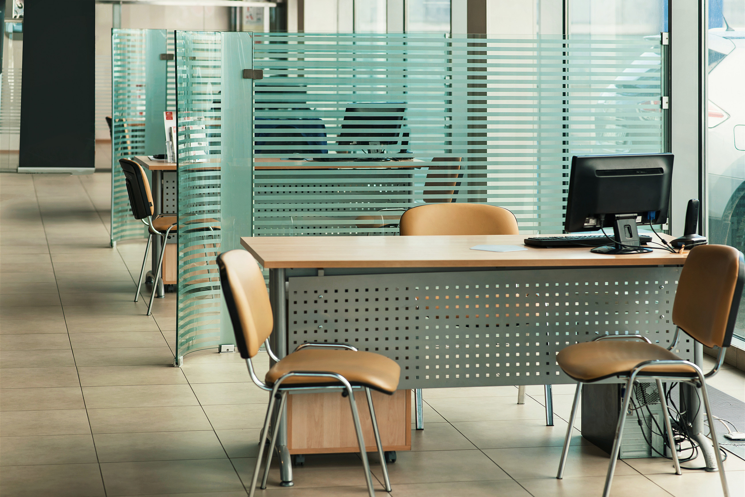 Commercial office space with patterned glass partitions