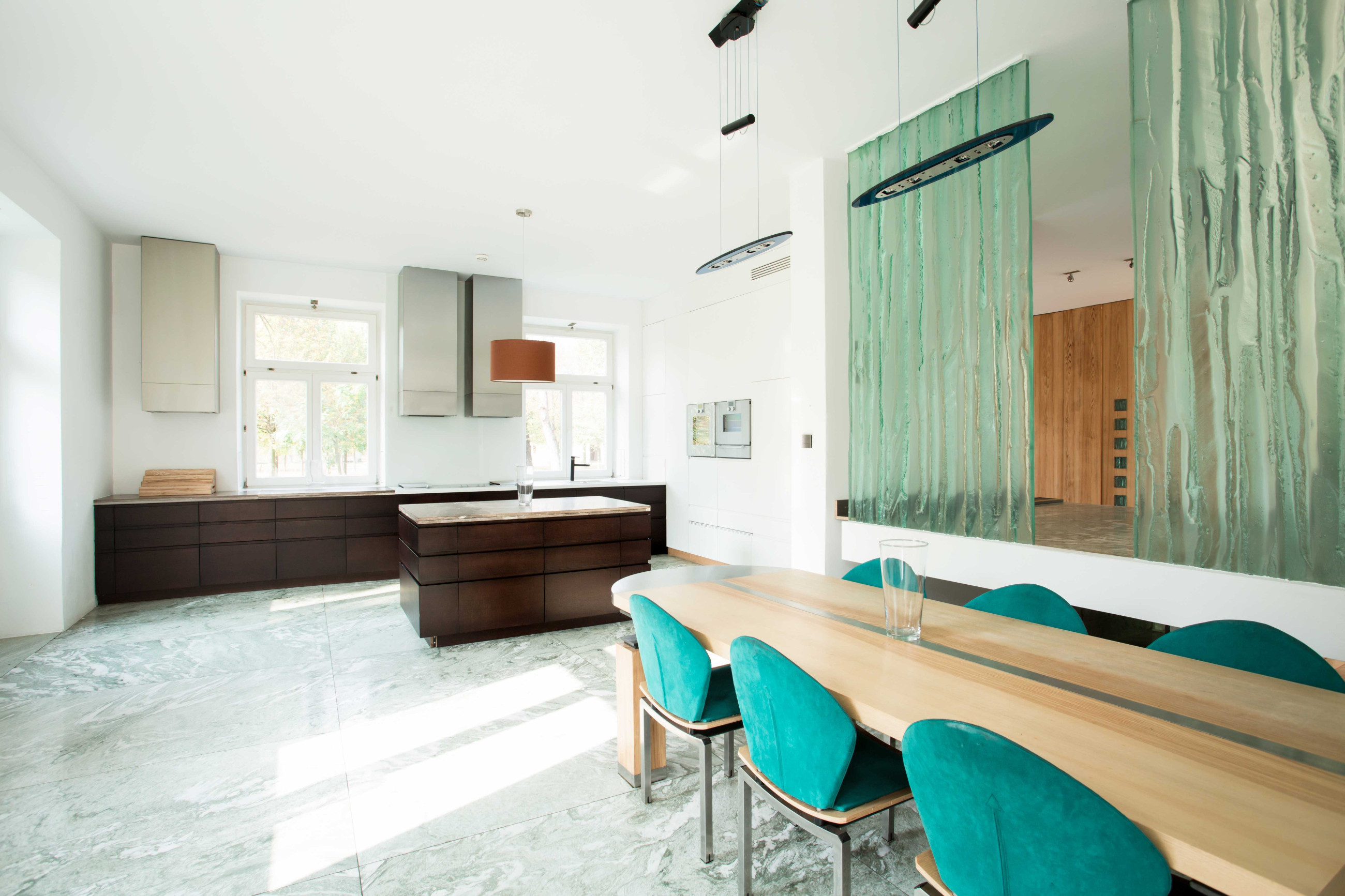 White living room with coloured glass partition