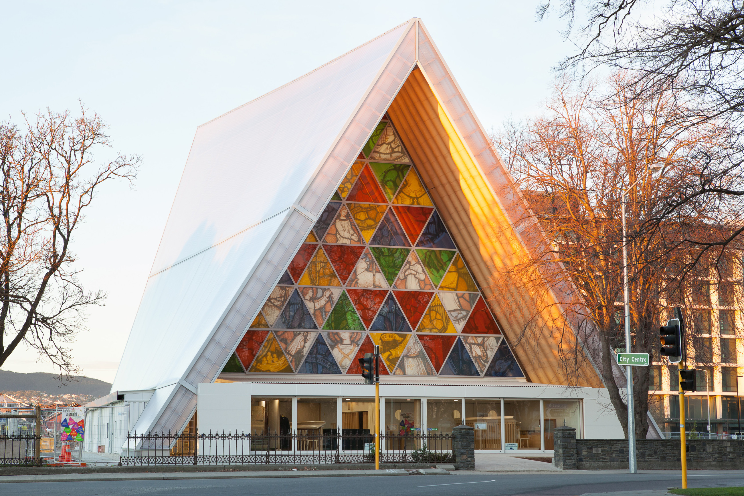 Colorful glazed window panels in mosaic pattern at triangle church