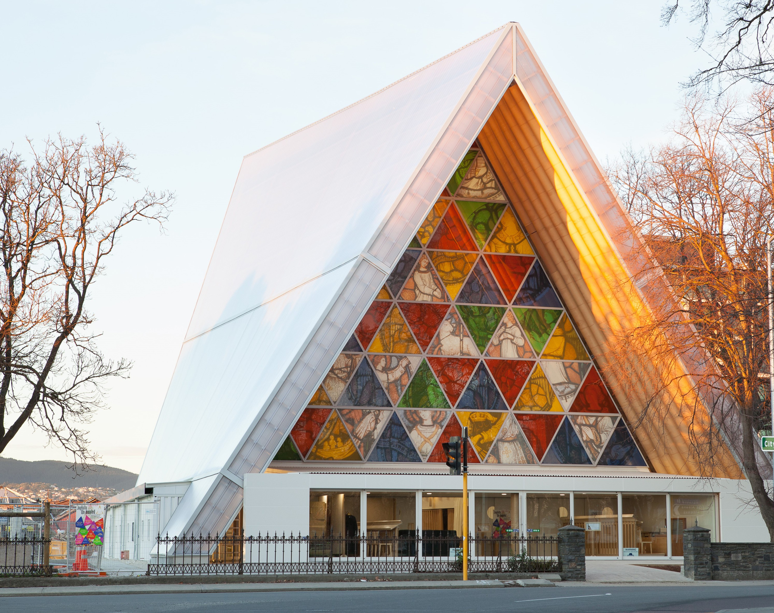 Colorful glazed window panels in mosaic pattern at triangle church