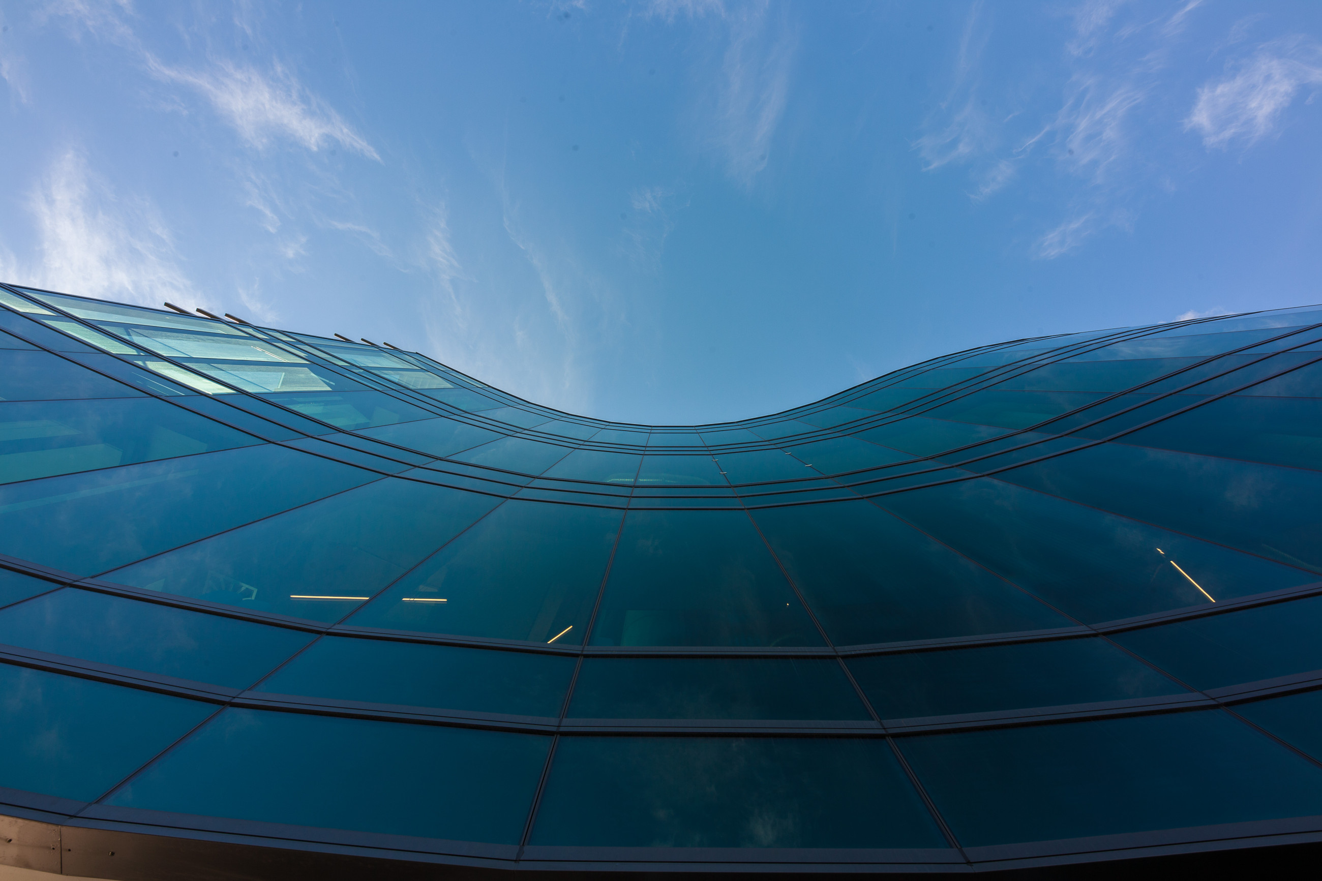 Modern building with curved Metro Glass wall.