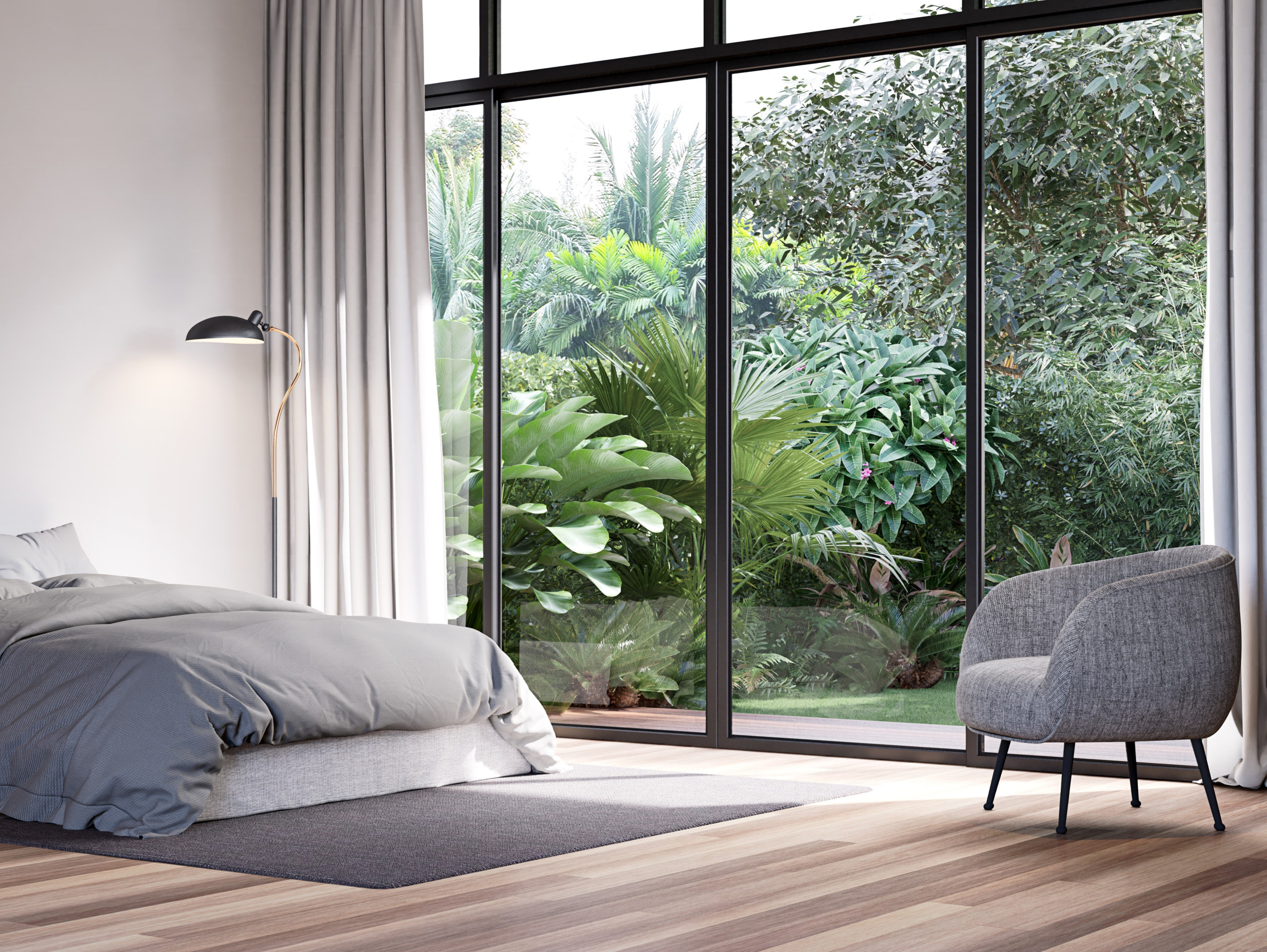 Cosy bedroom with bed, chair, and floor to celling windows overlooking a garden