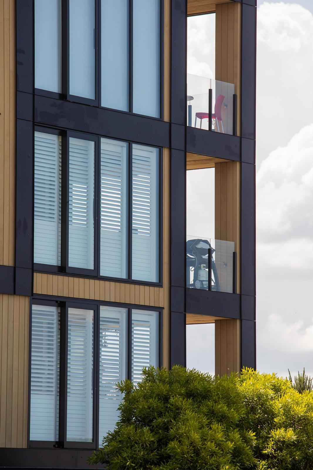 Contemporary skyscraper with floor-to-ceiling glass windows and glass balustrades