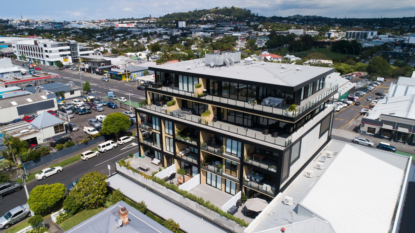 Glass-fronted apartment building with transparent balustrades