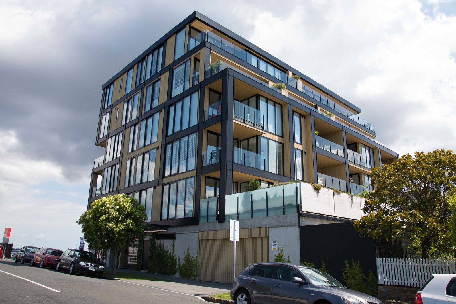 Modern building with floor-to-ceiling glass windows and glass balustrades