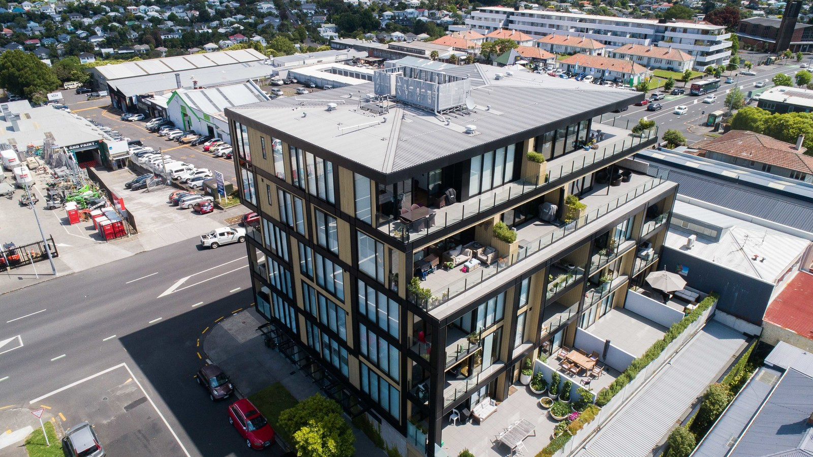 Glass-fronted apartment building with transparent balustrades