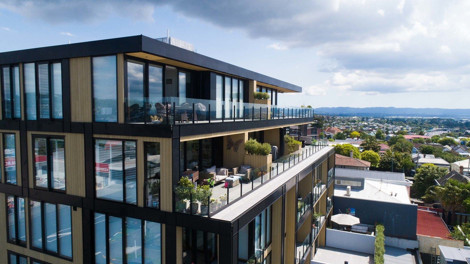 Modern apartment building with glass windows and glass balustrades