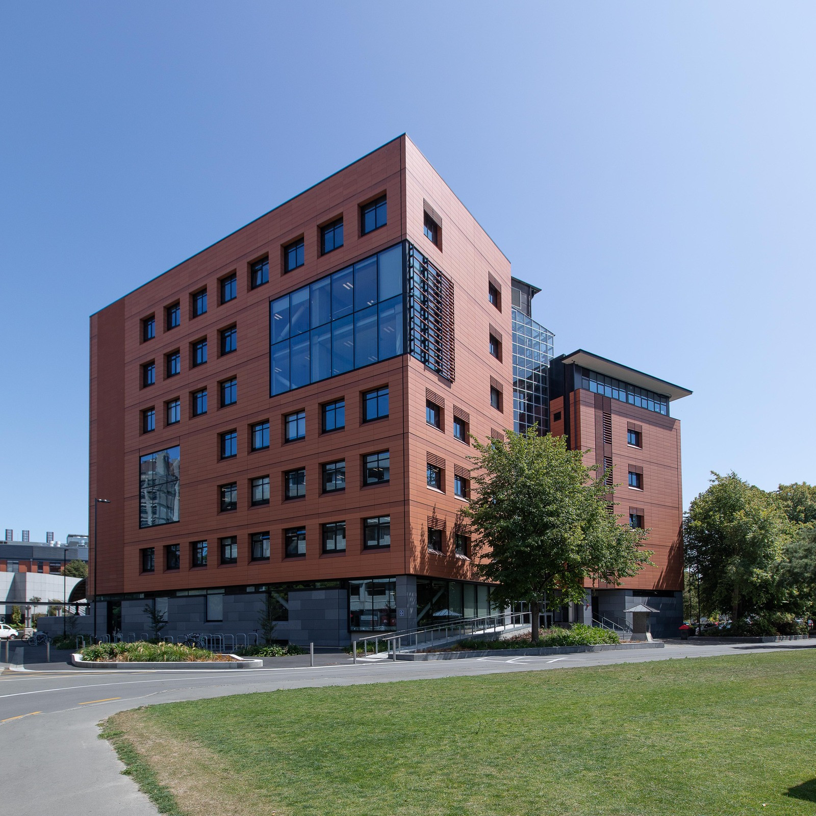 Red brick contemporary building with prominent glass windows