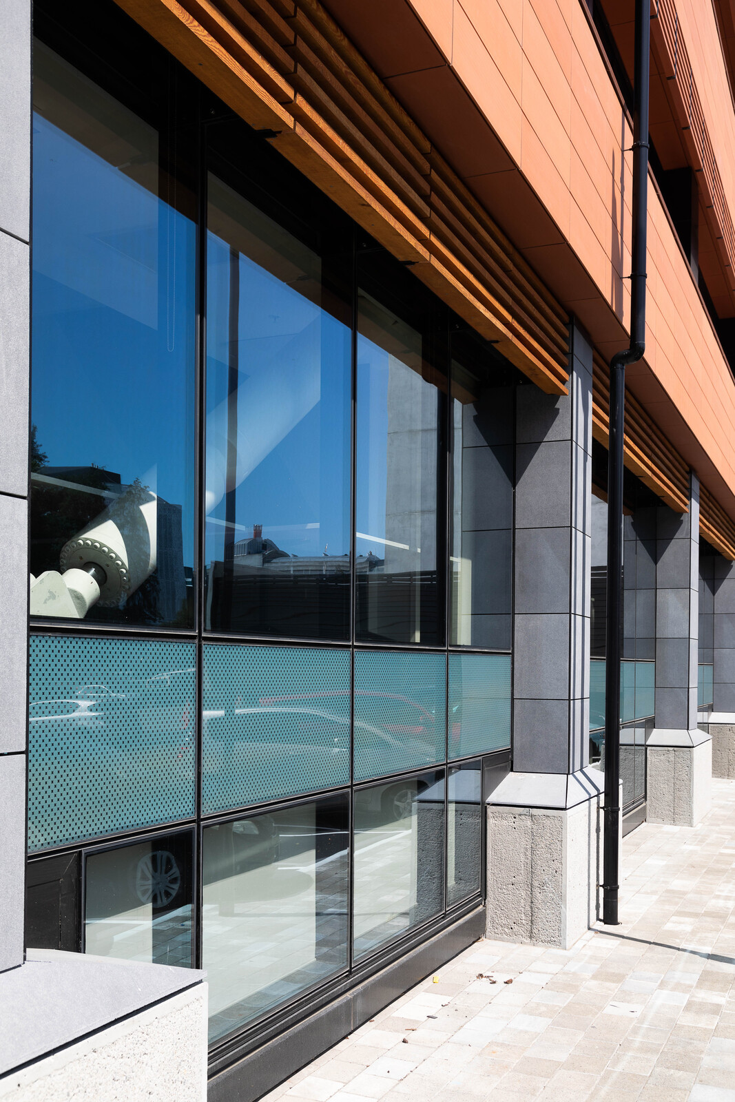 Red brick contemporary building with large glass windows