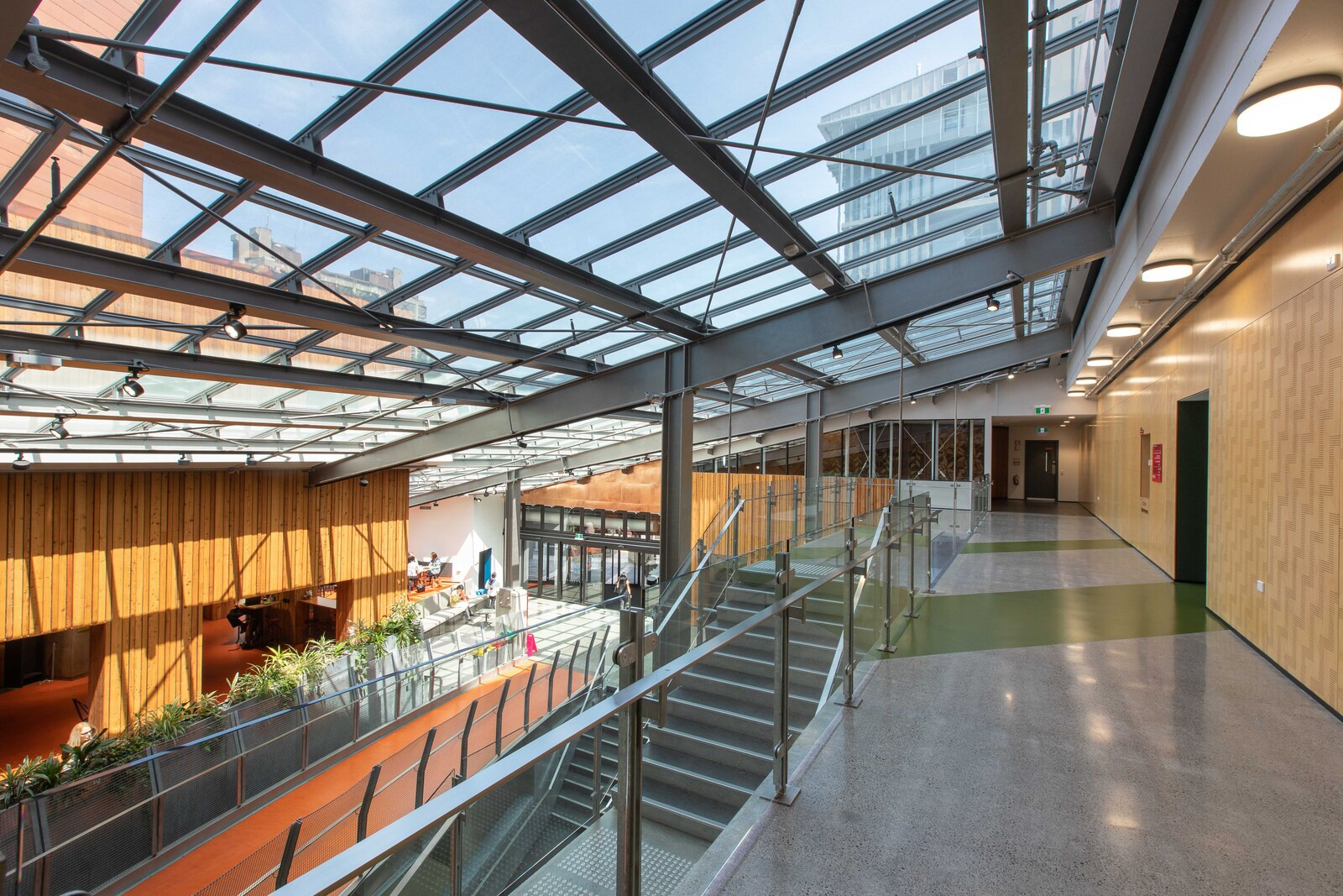 Spacious room with a modern angular skylight above