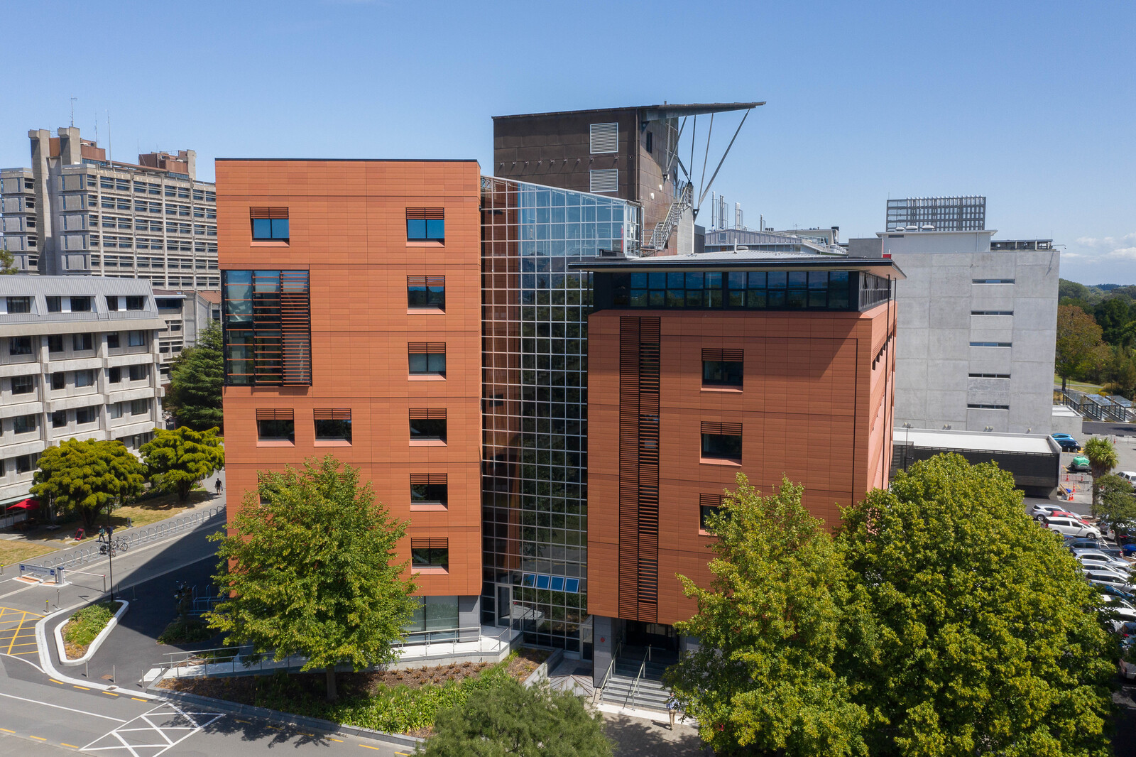 Modern multi-story structure with large reflective glass windows