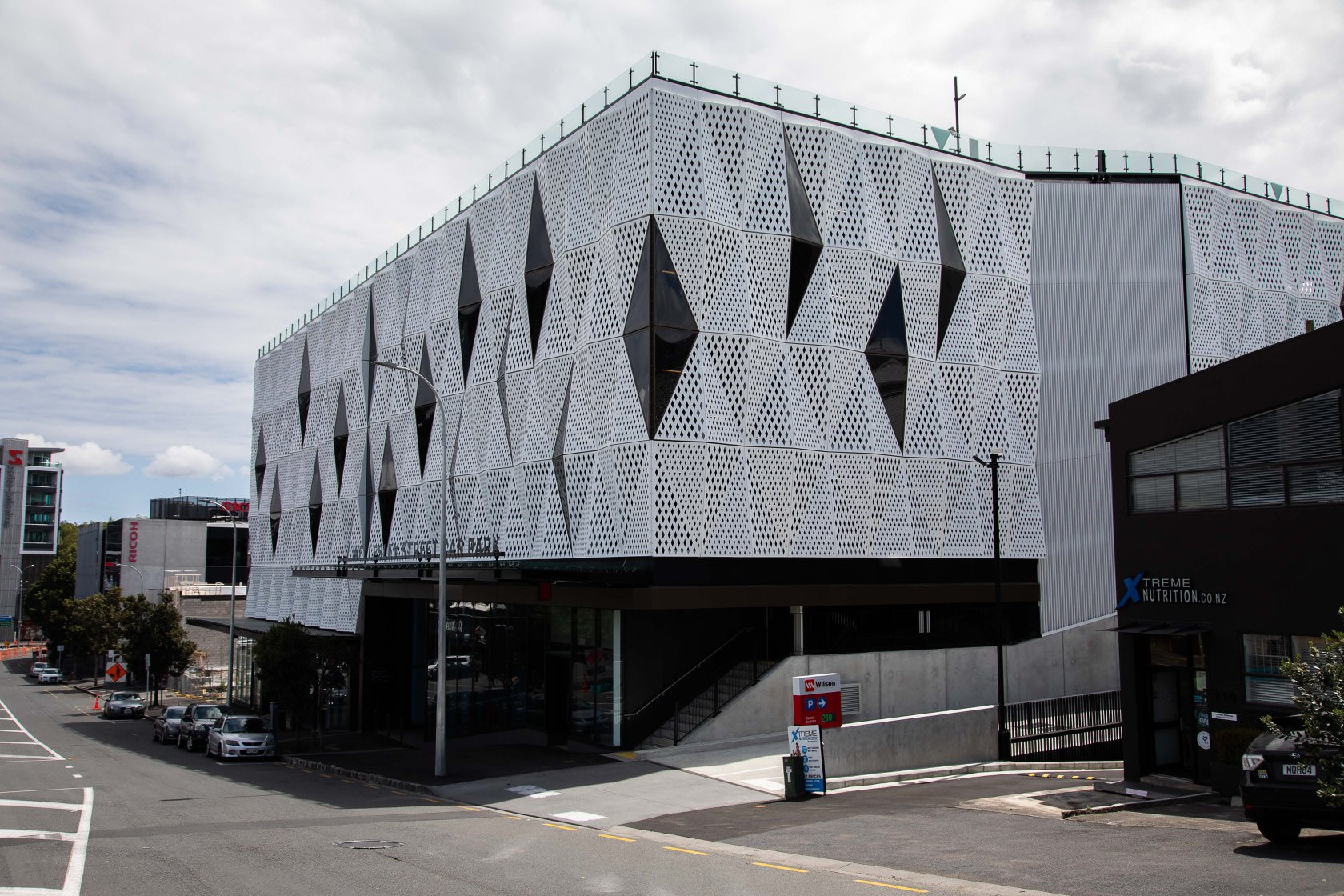 Building with geometric patterned facade and hidden windows