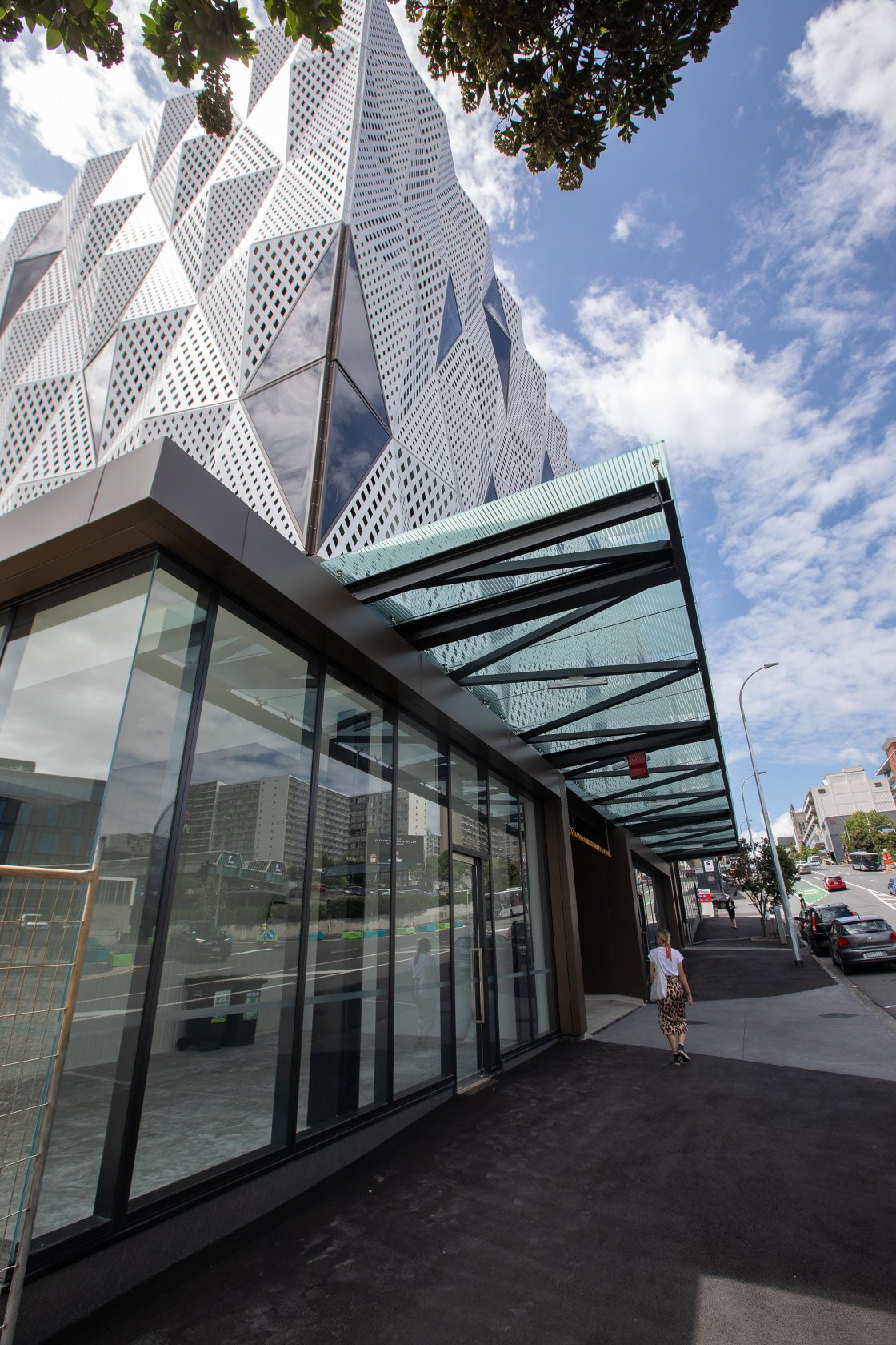 Artistic white facade with integrated glass windows on a modern building