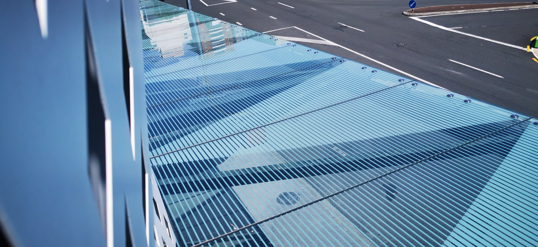 Modern building with geometric patterned glass canopy