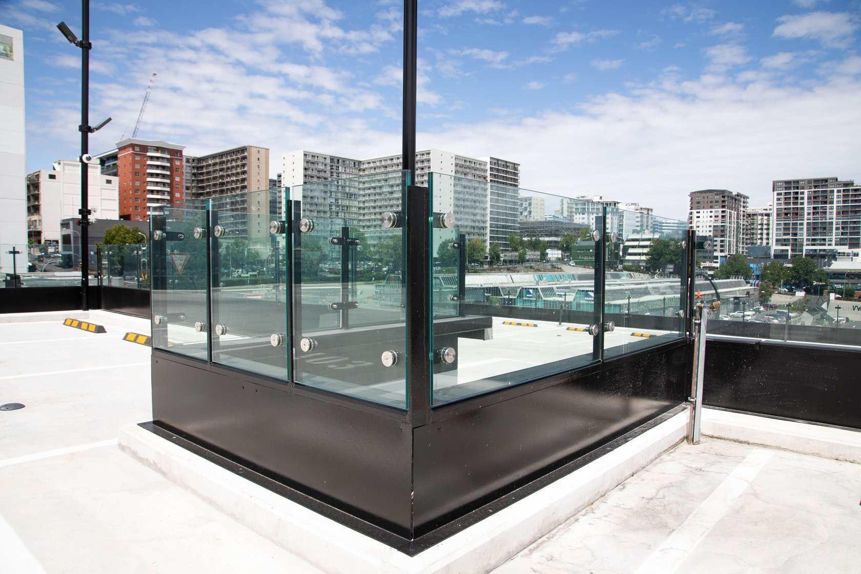 Transparent safety balustrades made of glass, offering a panoramic overlook of the urban horizon