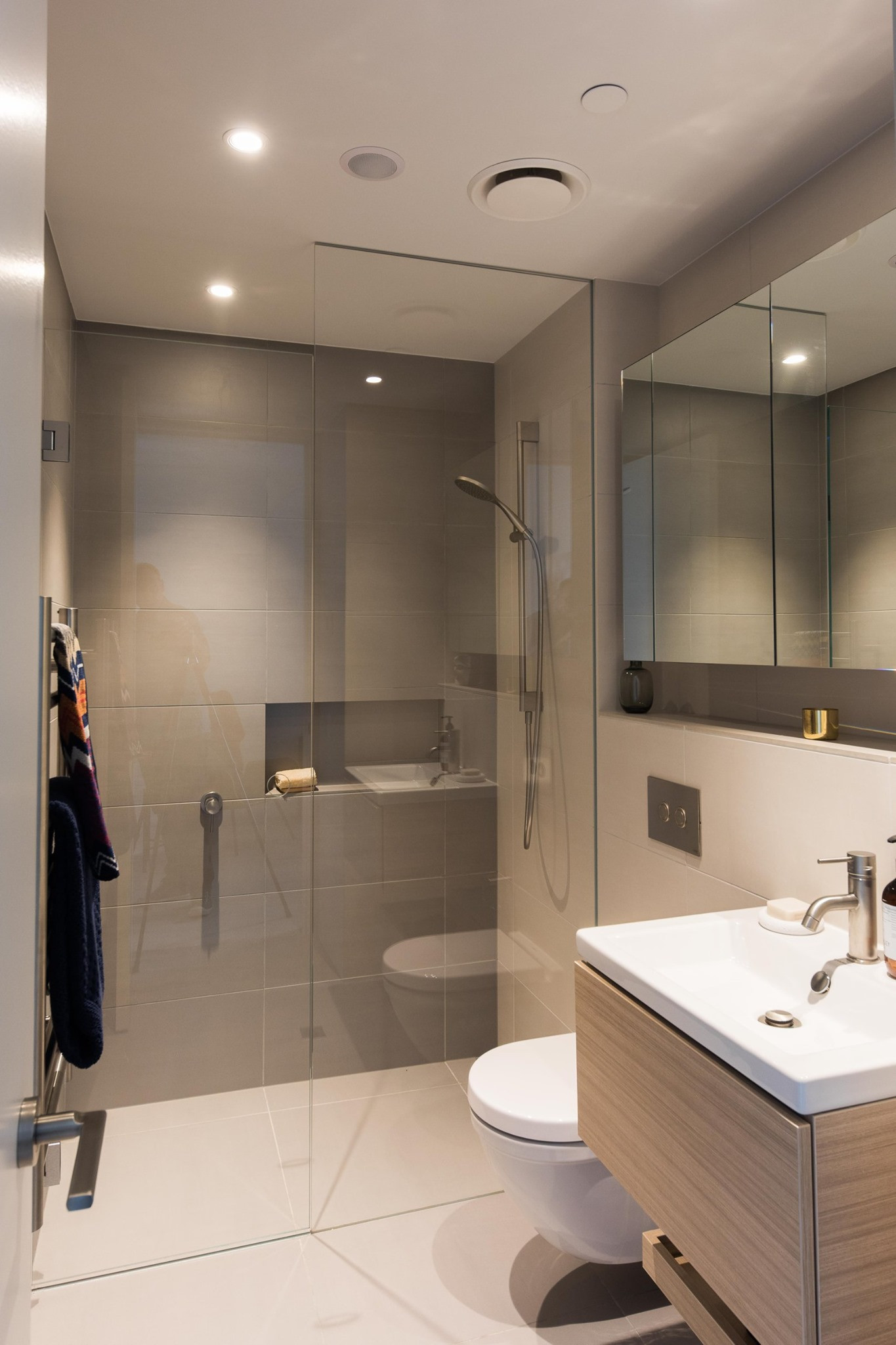 Modern bathroom, featuring glass shower screen, toilet and basin