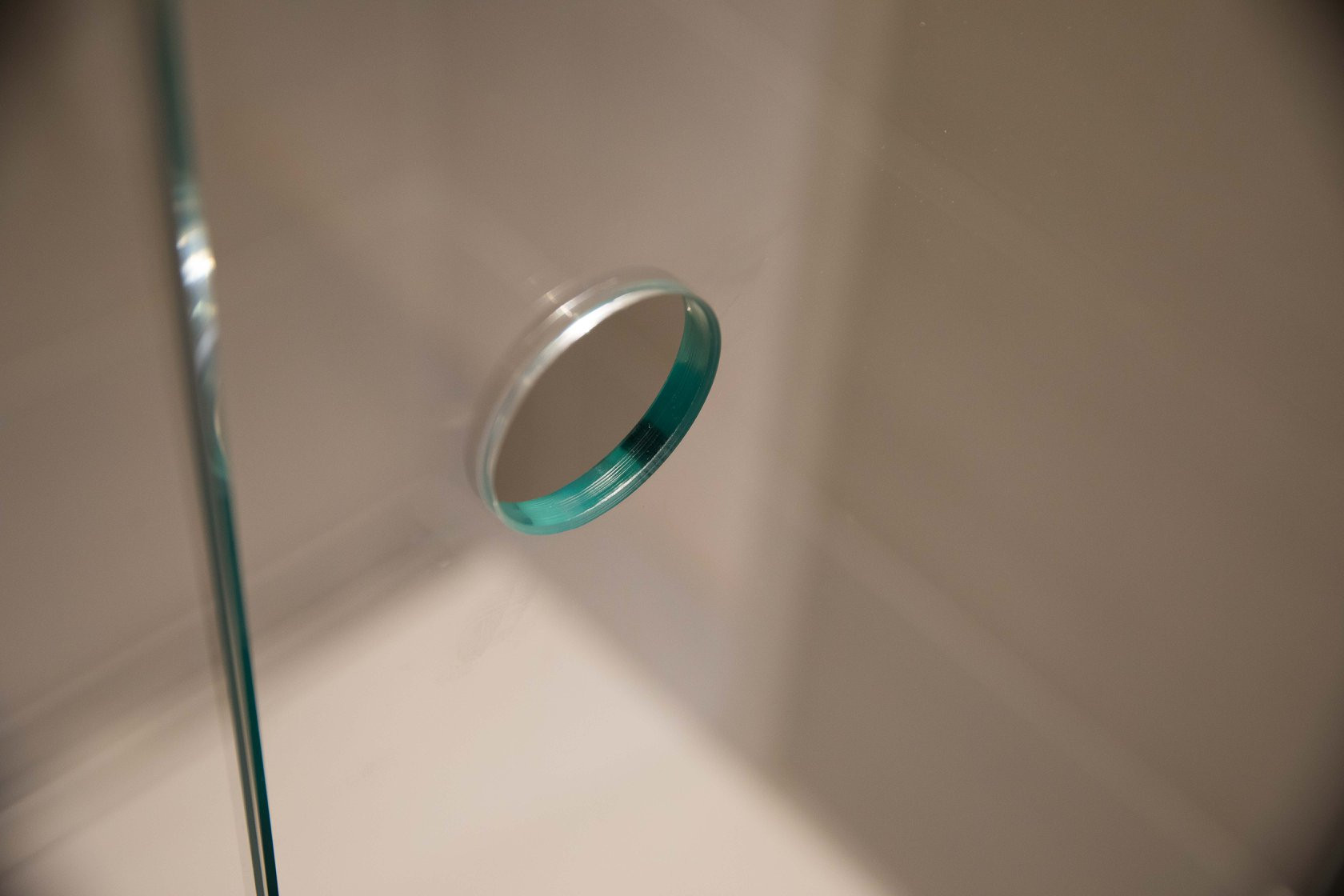 Glass shower screen with finger hole opening