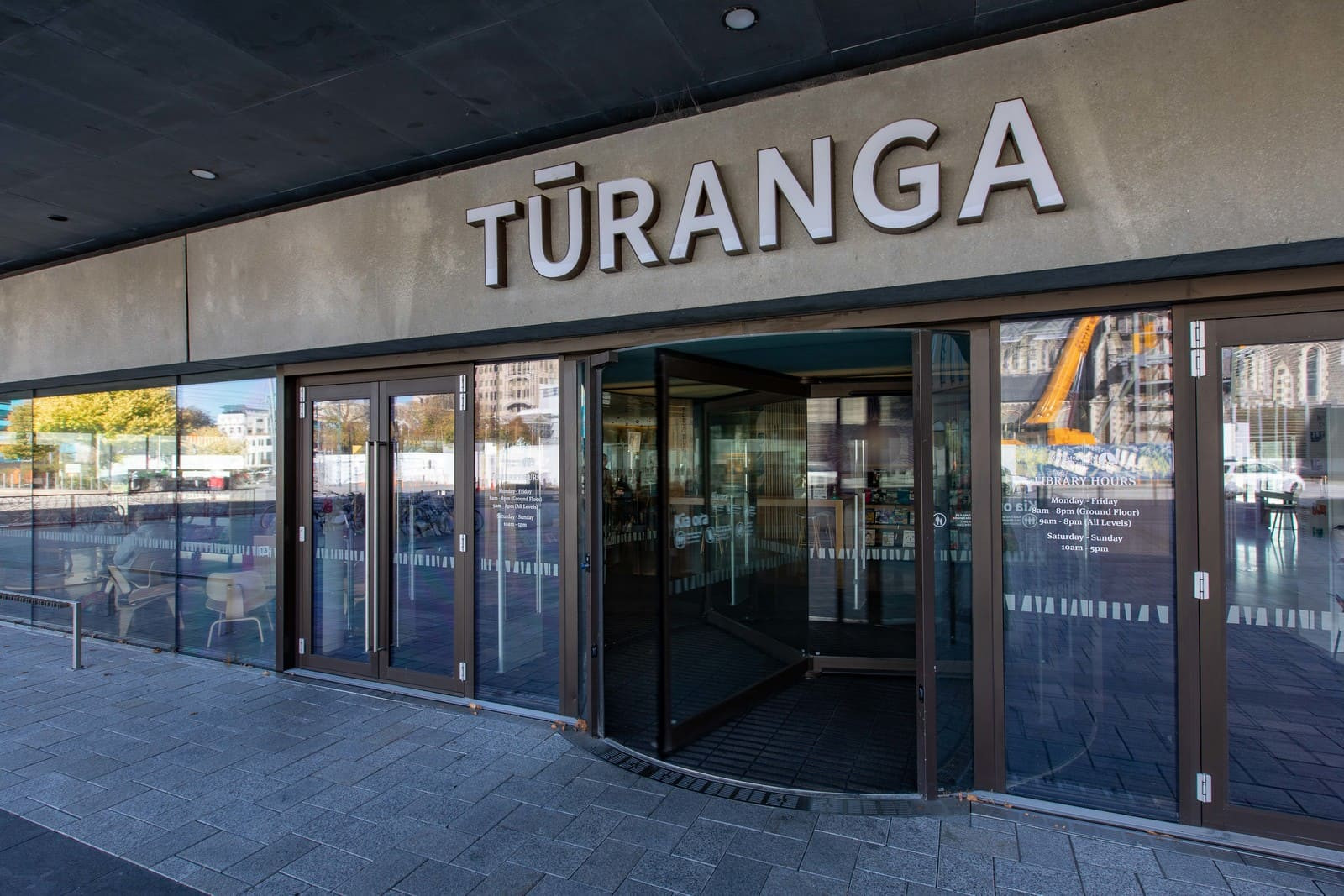 Glass entrance to Christchurch library, 'Turanga' displayed prominently