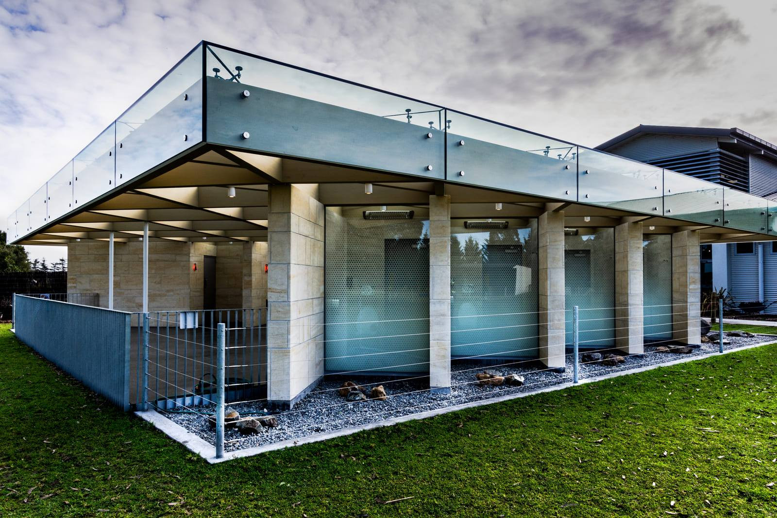 Highlighted glass panels add charm to a light brick building