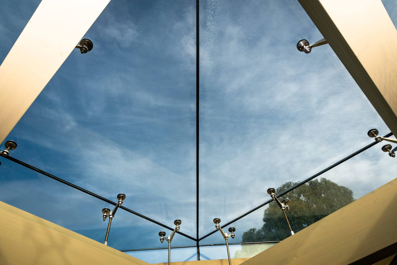 Sky view through highlighted glass panels