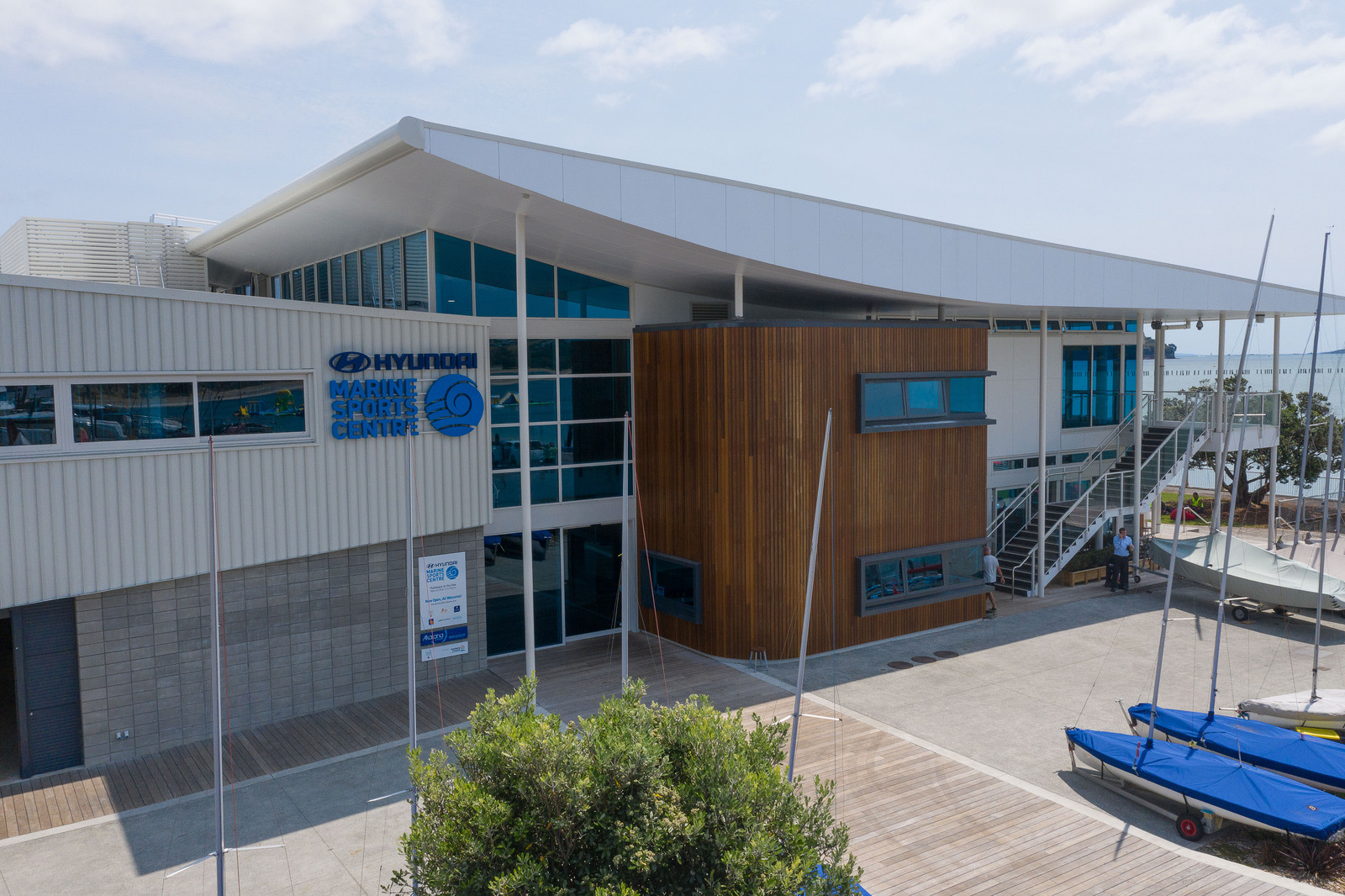 Tinted windows and wooden timber exterior on white urban building