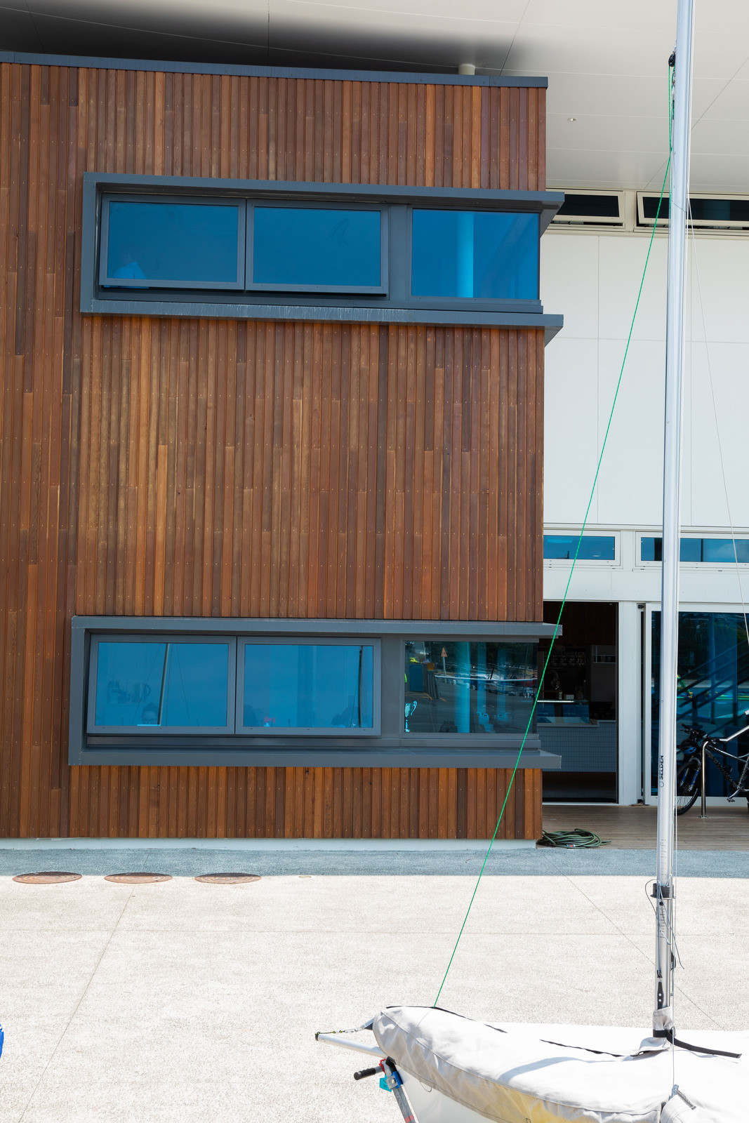 Glass tinted windows on building with highlighted wooden timber exterior