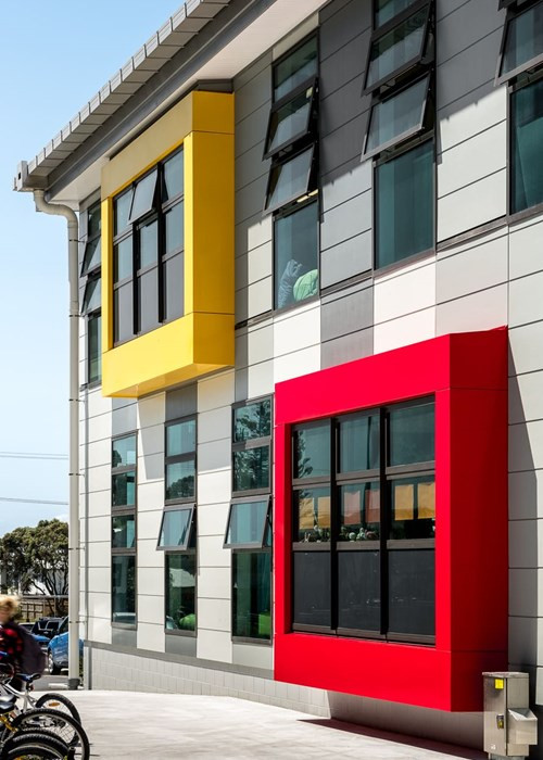 Opope Beach School's vibrant building, showcasing floor to ceiling windows