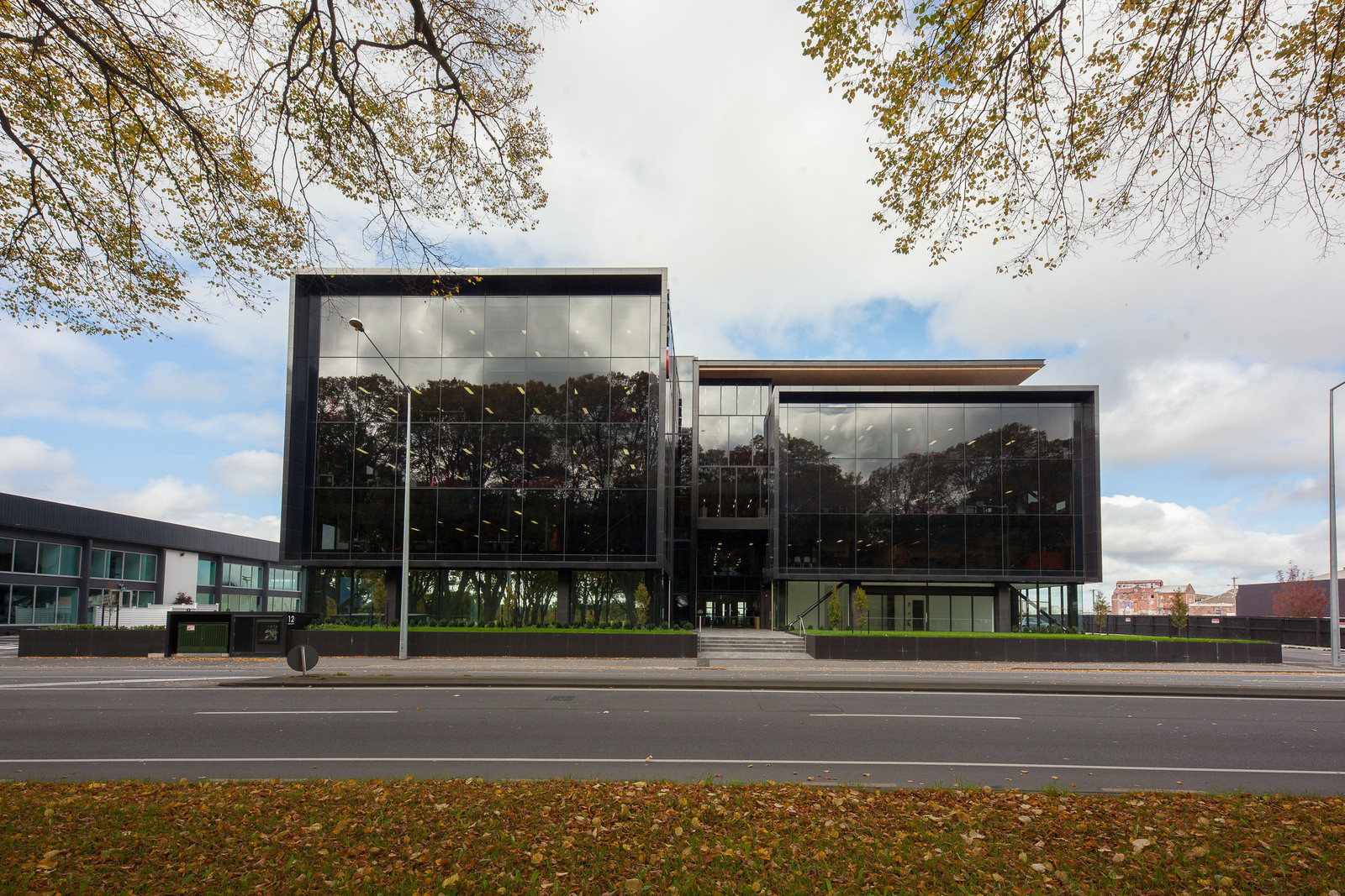 Contemporary Opus house, dark tinted windows, in front of road