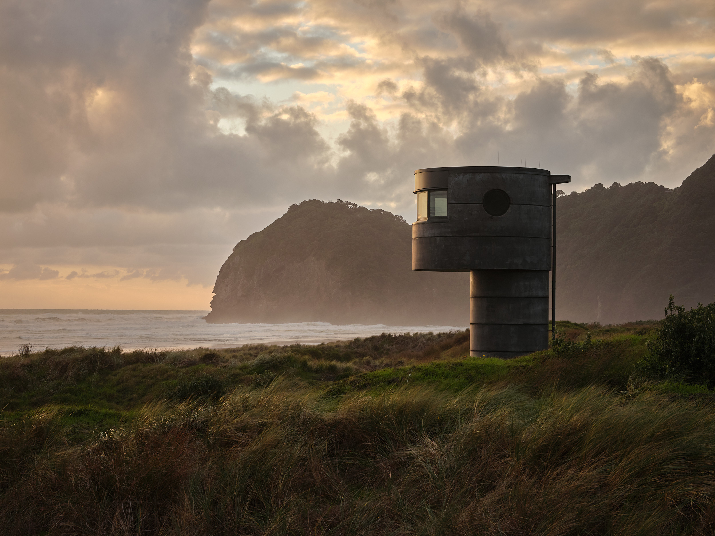 Tower with glass windows on beach overlooking ocean