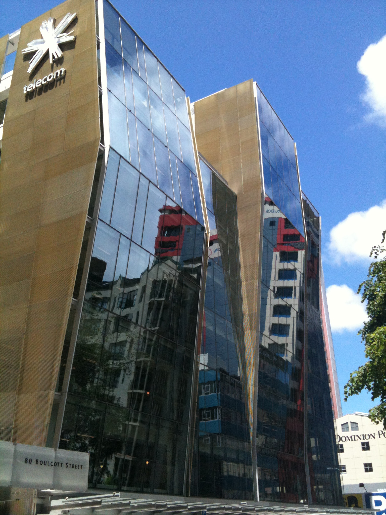 A towering skyscraper with a vast glass front