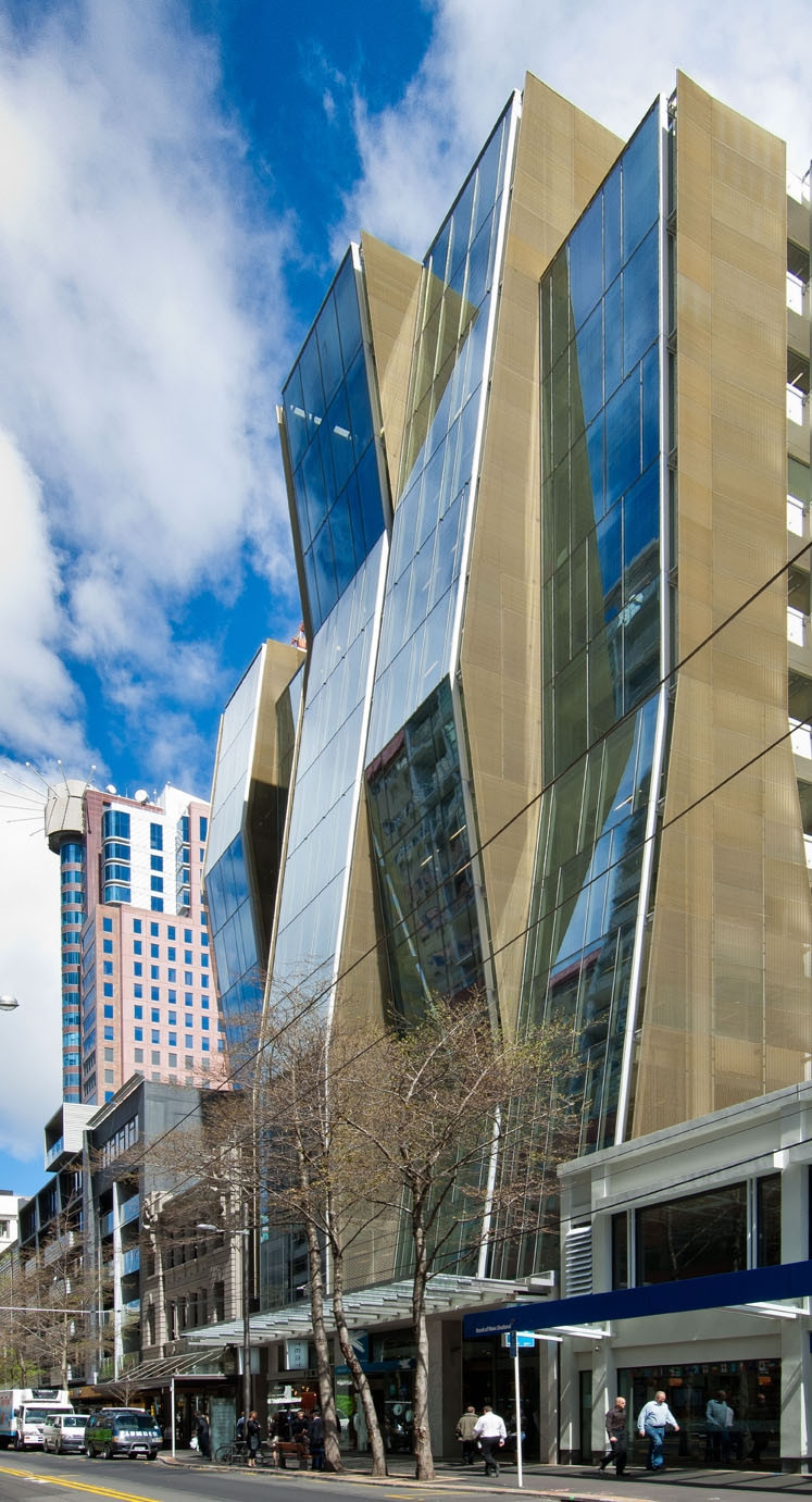 A sleek commercial building with a massive glass facade