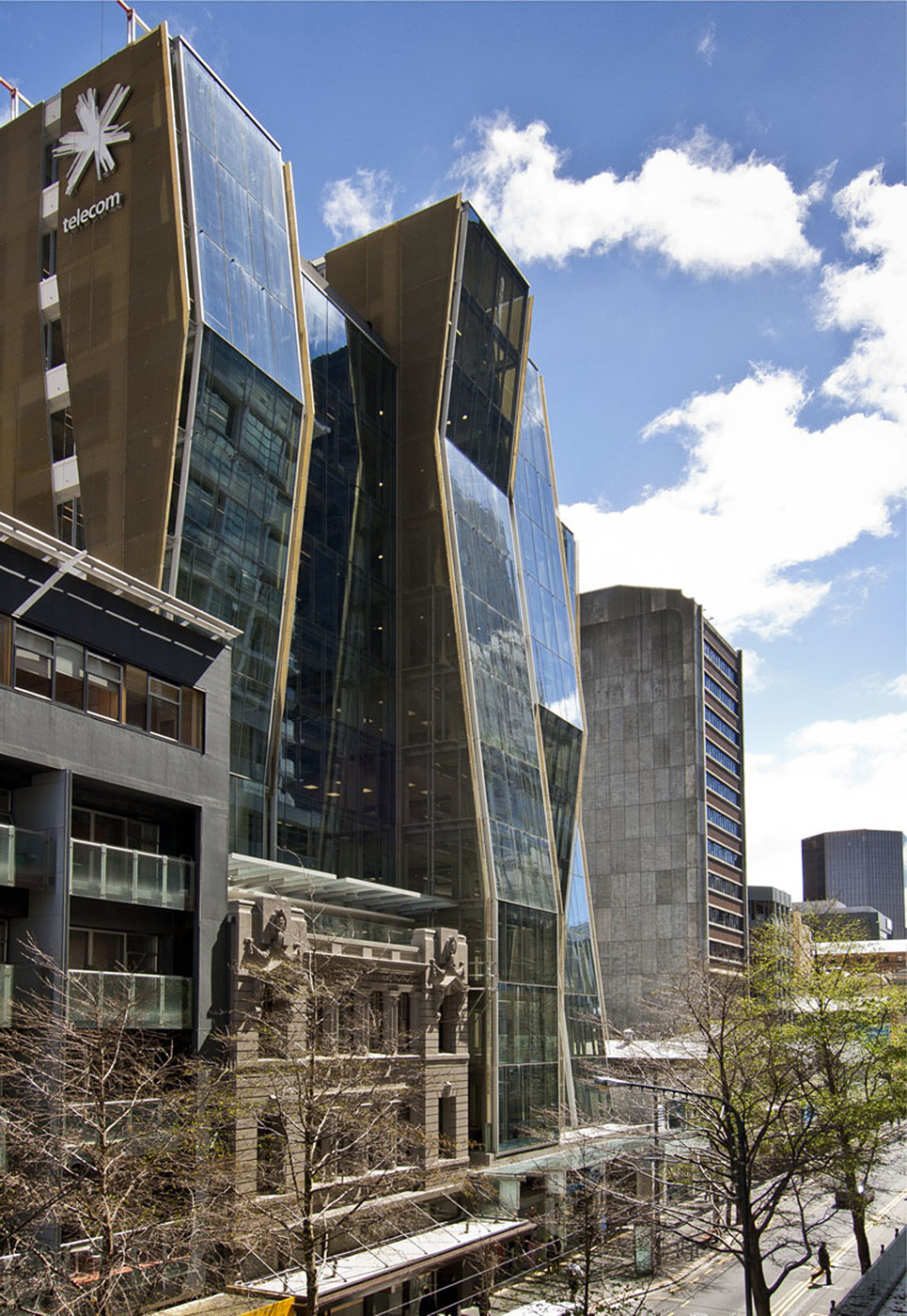 A sleek commercial building with a massive glass facade