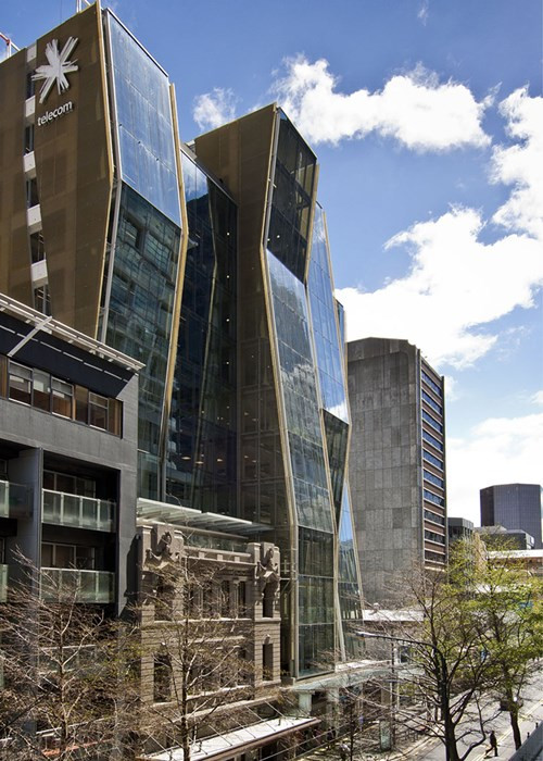 A tall commercial building with a large glass facade